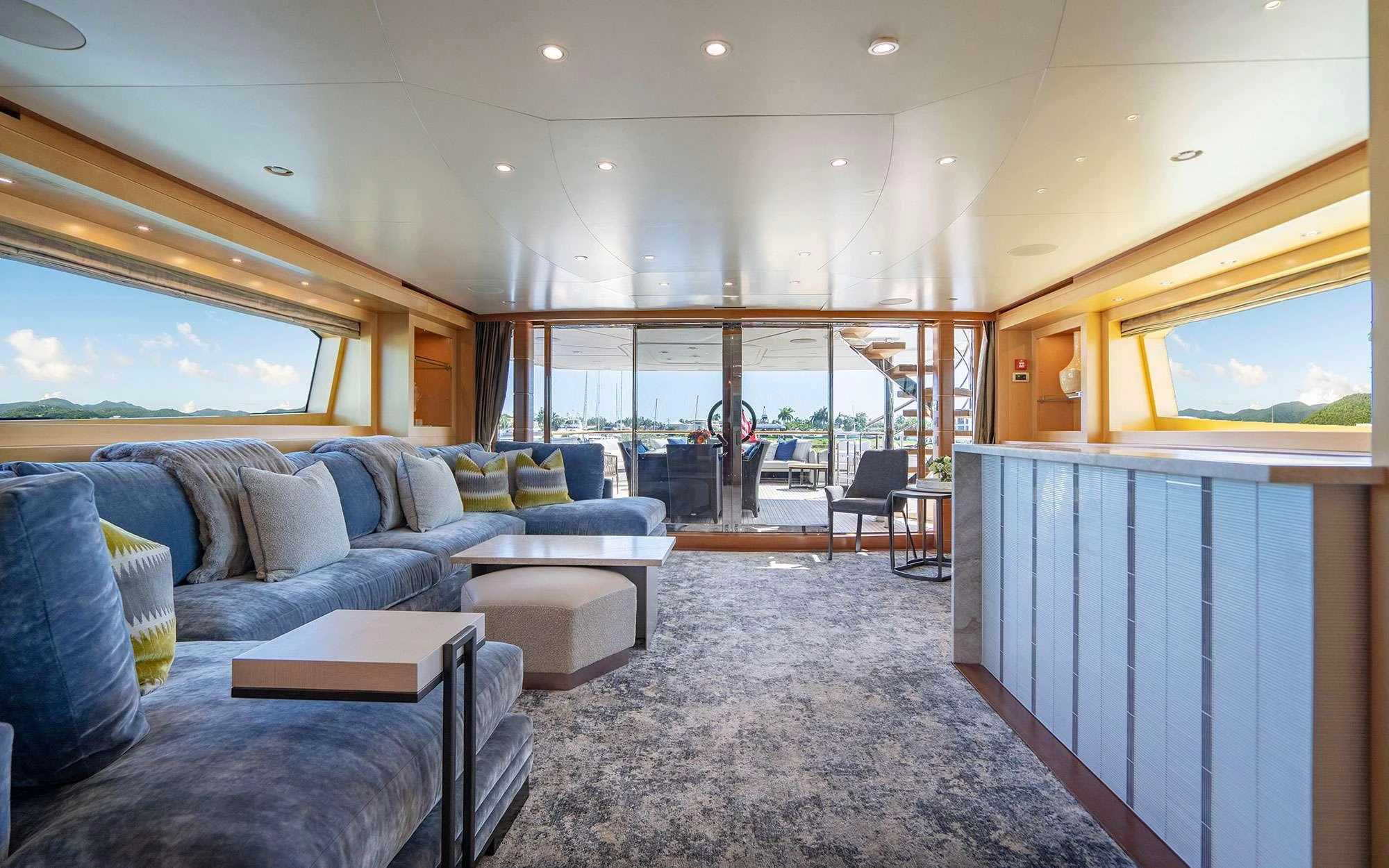a living room with a large window aboard WHY NOT Yacht for Charter