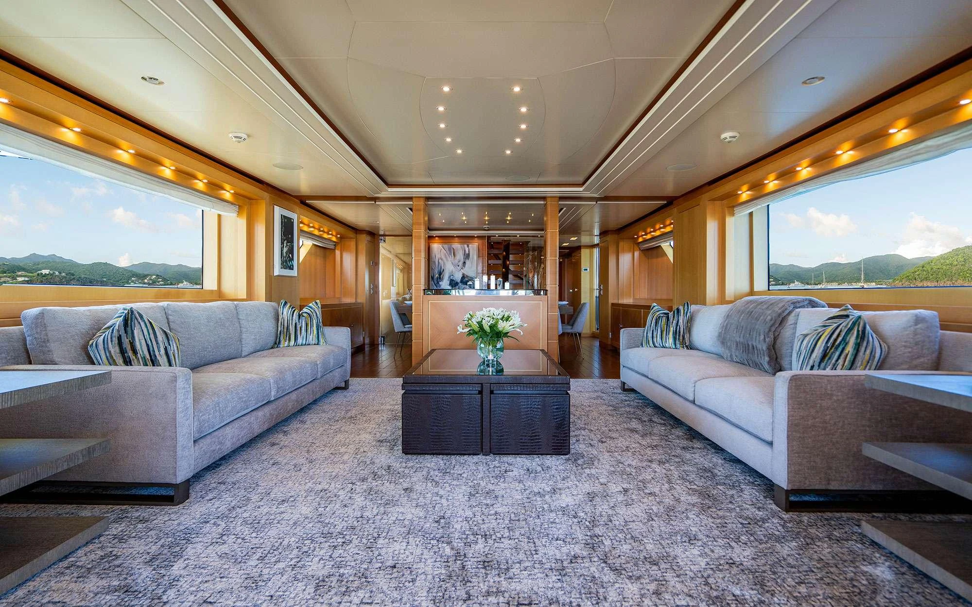 a living room with a couch and a coffee table aboard WHY NOT Yacht for Charter