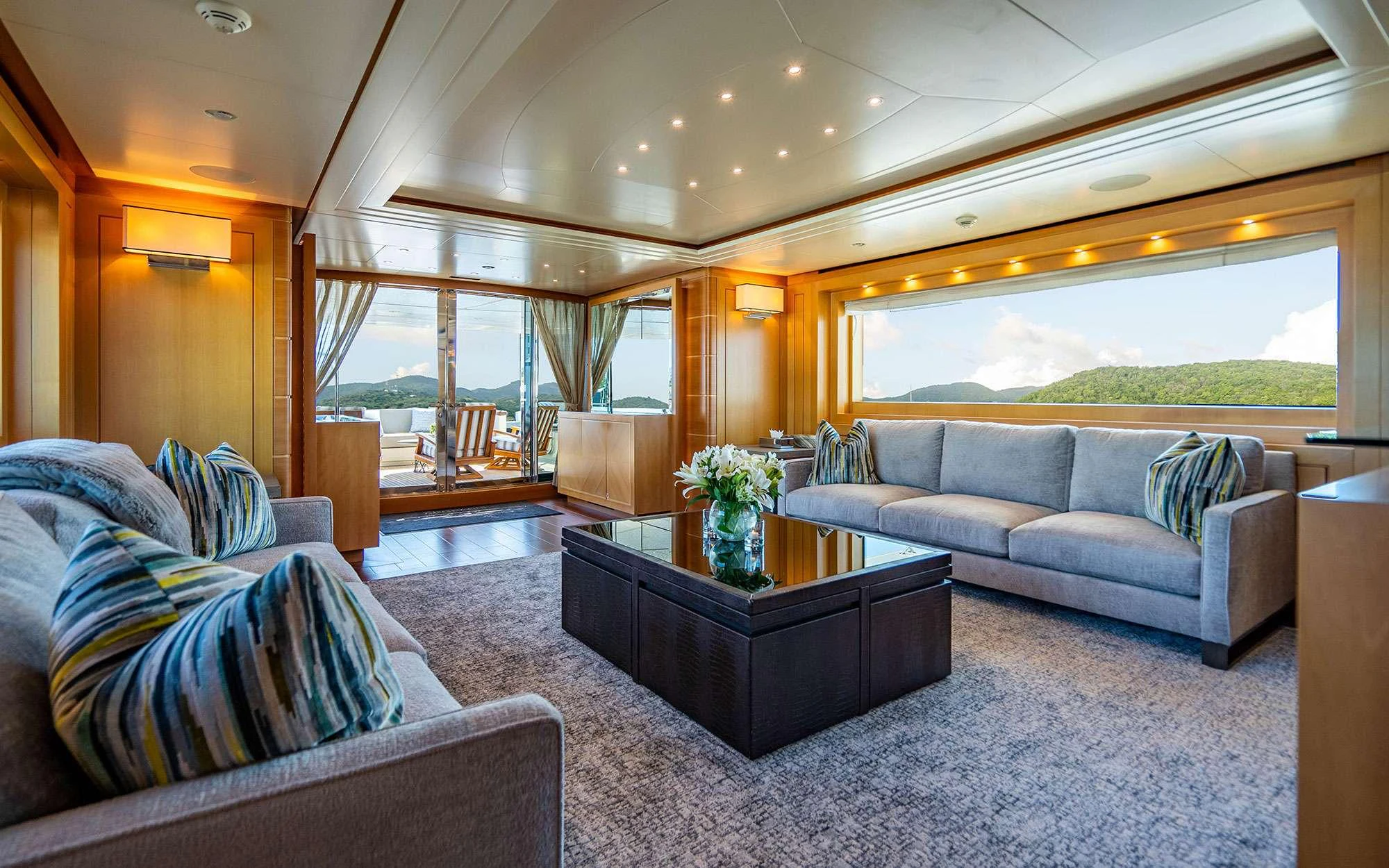 a living room with a large window aboard WHY NOT Yacht for Charter