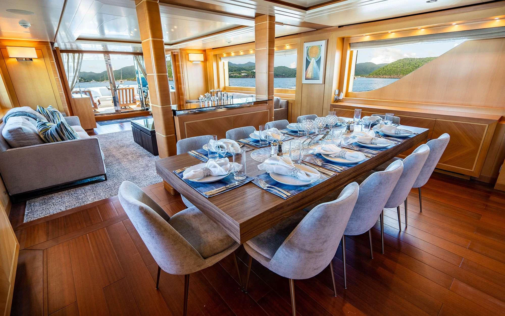 a dining table with chairs aboard WHY NOT Yacht for Charter