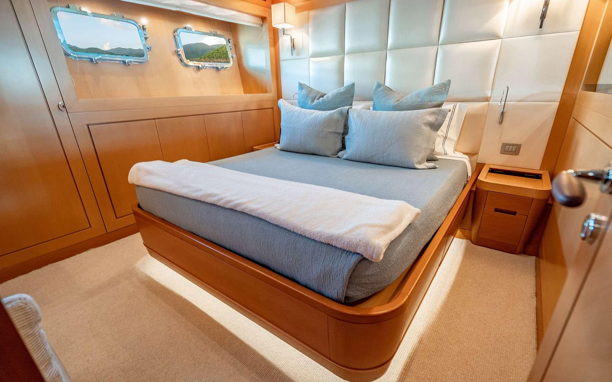 a bed in a room aboard WHY NOT Yacht for Charter