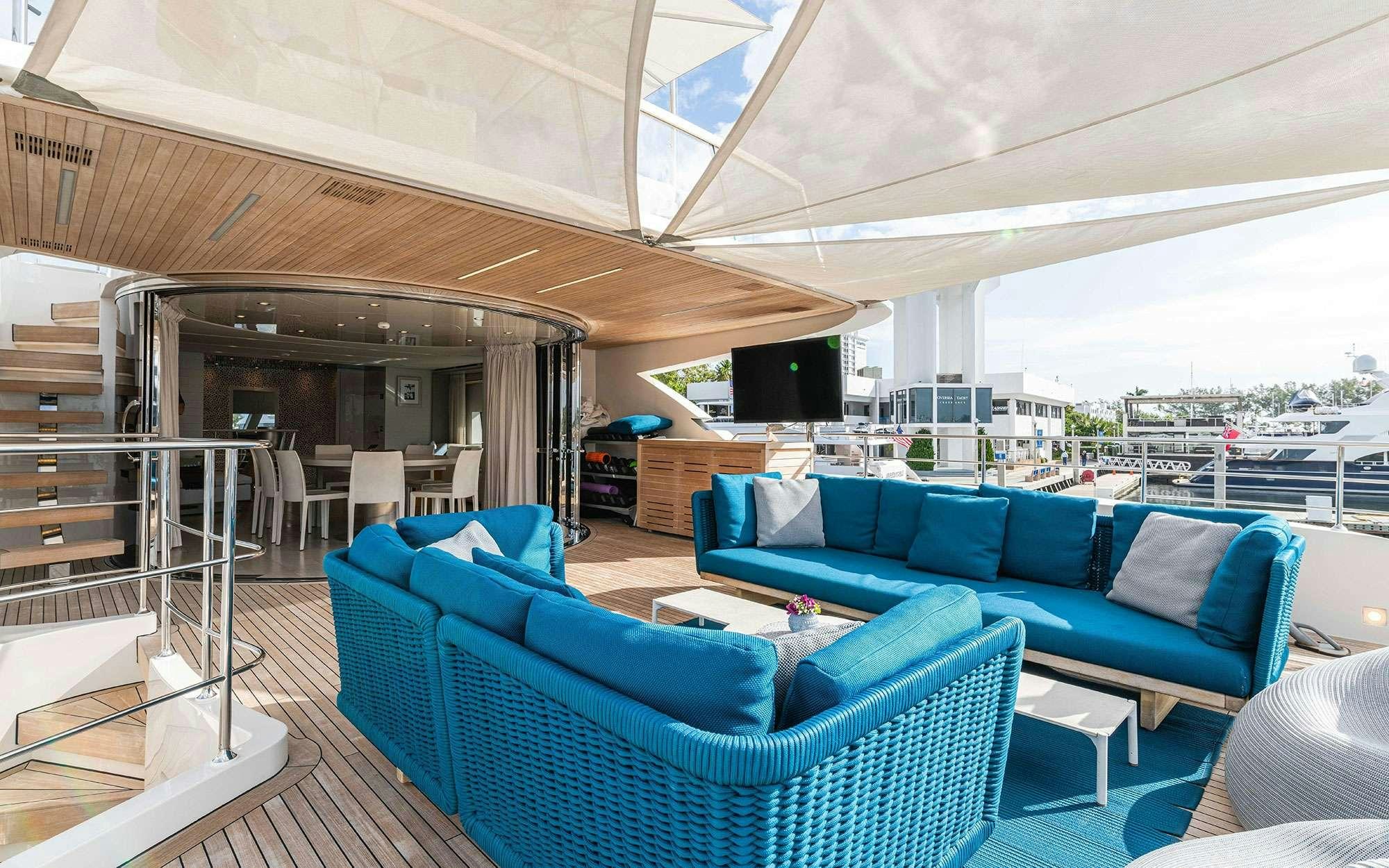 a living room with a large balcony aboard HALCYON Yacht for Charter