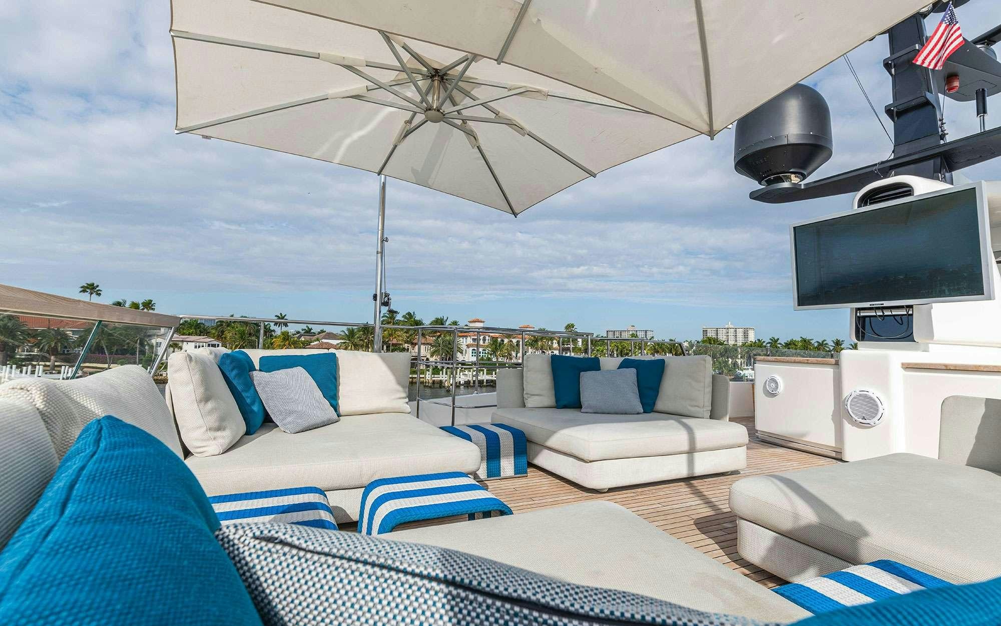 a living room with a large patio aboard HALCYON Yacht for Charter