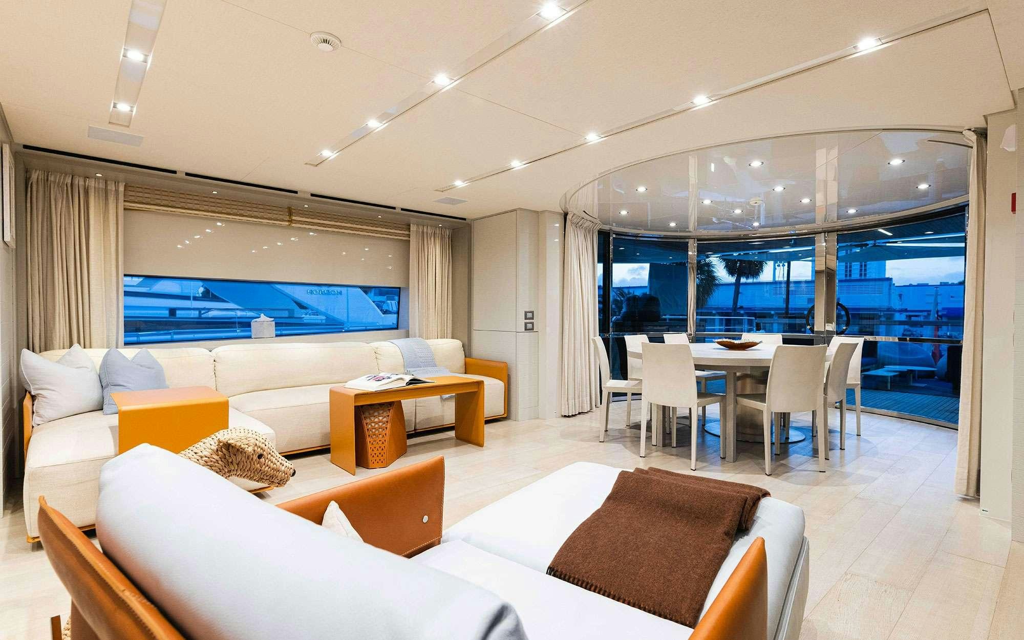a room with a couch and a table and chairs aboard HALCYON Yacht for Charter