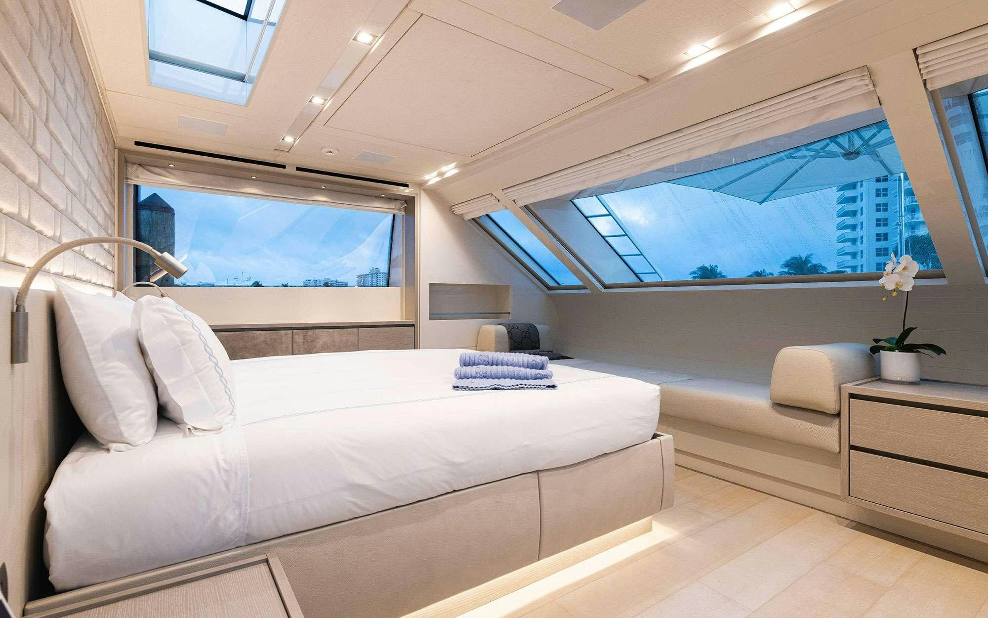 a white bed in a room aboard HALCYON Yacht for Charter