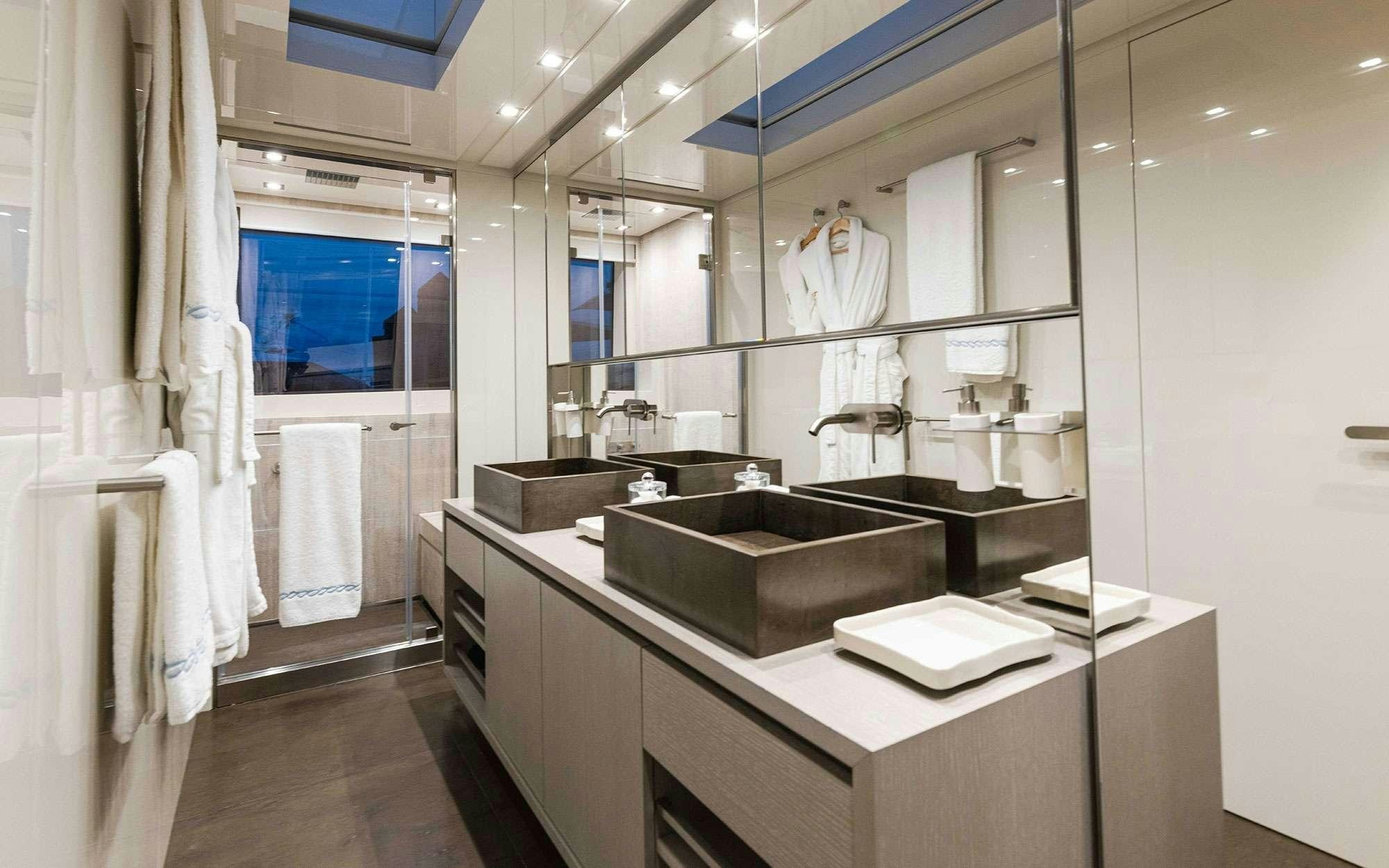 a bathroom with a sink and a mirror aboard HALCYON Yacht for Charter