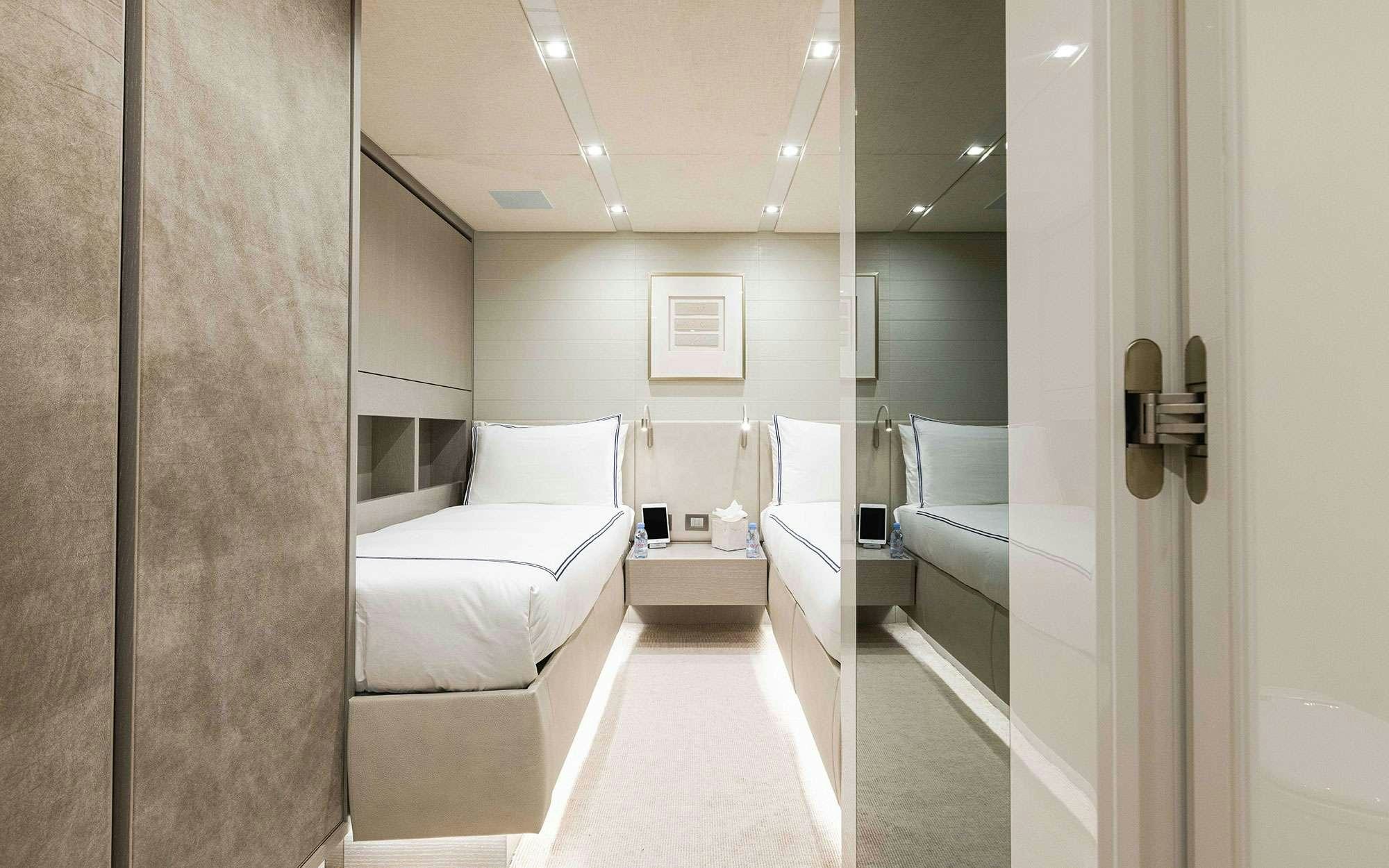 a room with a bed and a mirror aboard HALCYON Yacht for Charter