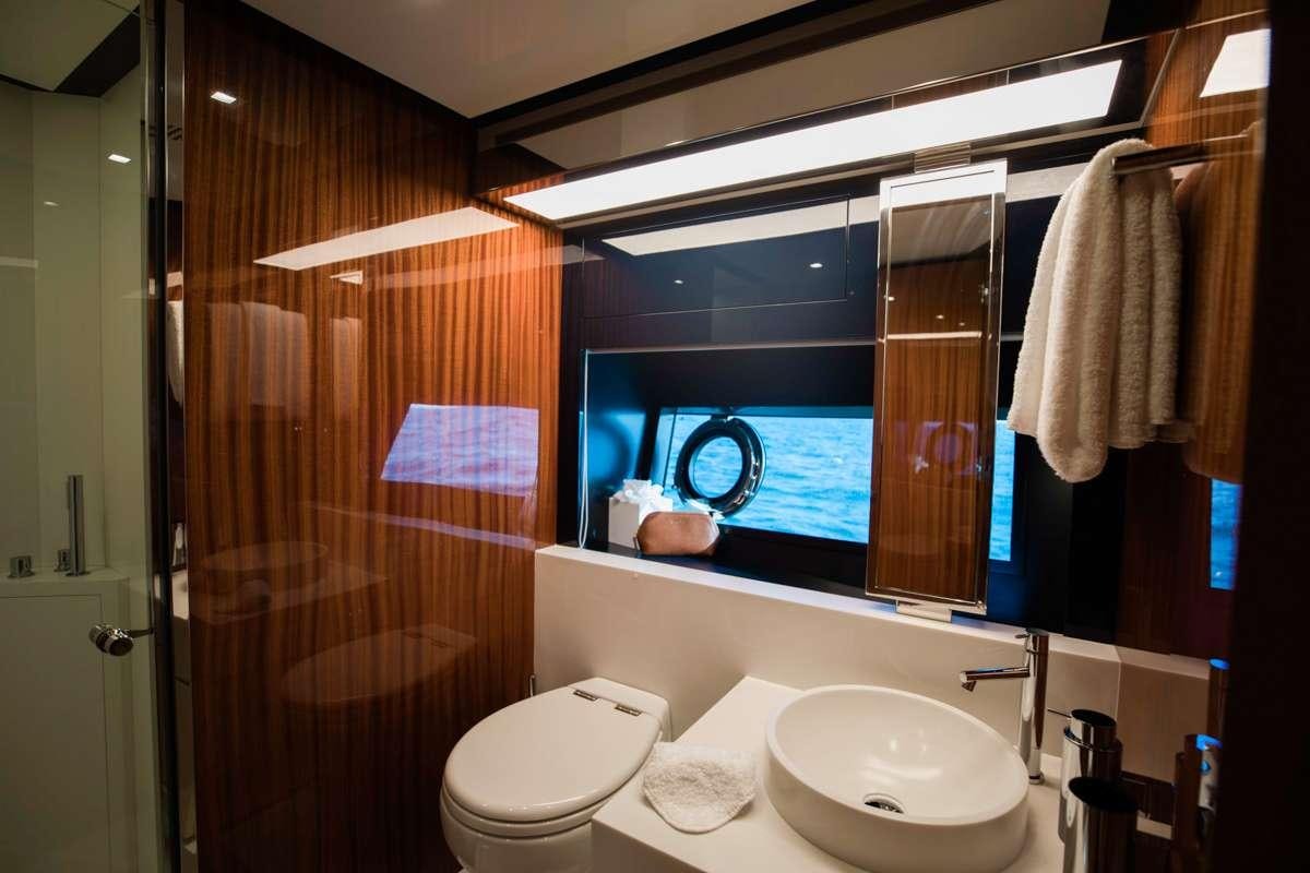 a bathroom with a sink and a toilet aboard NOT YET Yacht for Charter