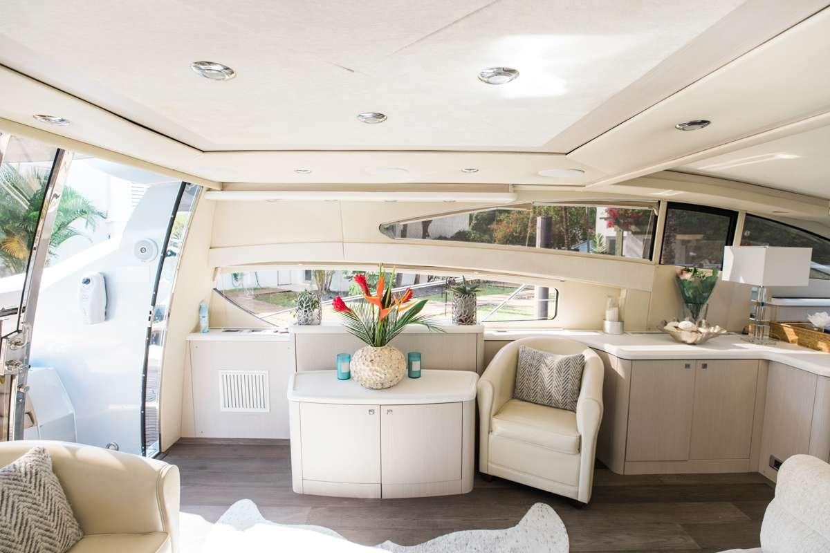 a kitchen with a table and chairs aboard LION Yacht for Charter