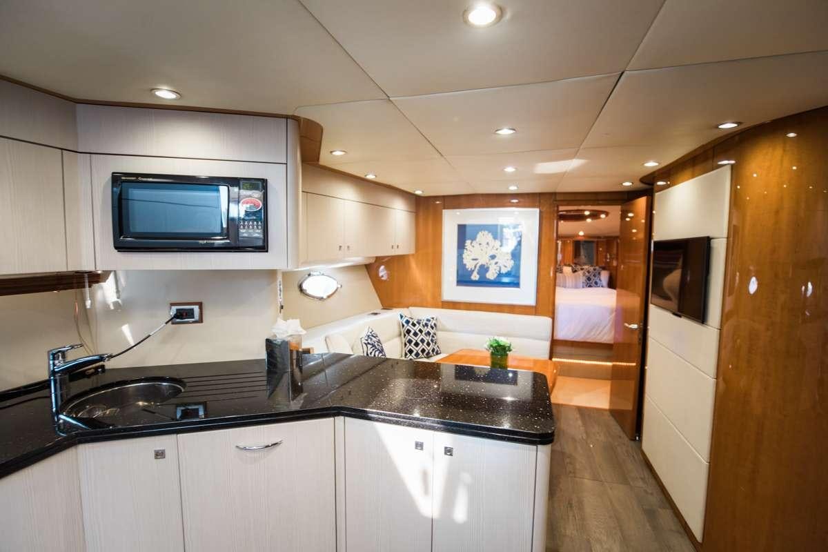 a kitchen with a microwave oven aboard LION Yacht for Charter