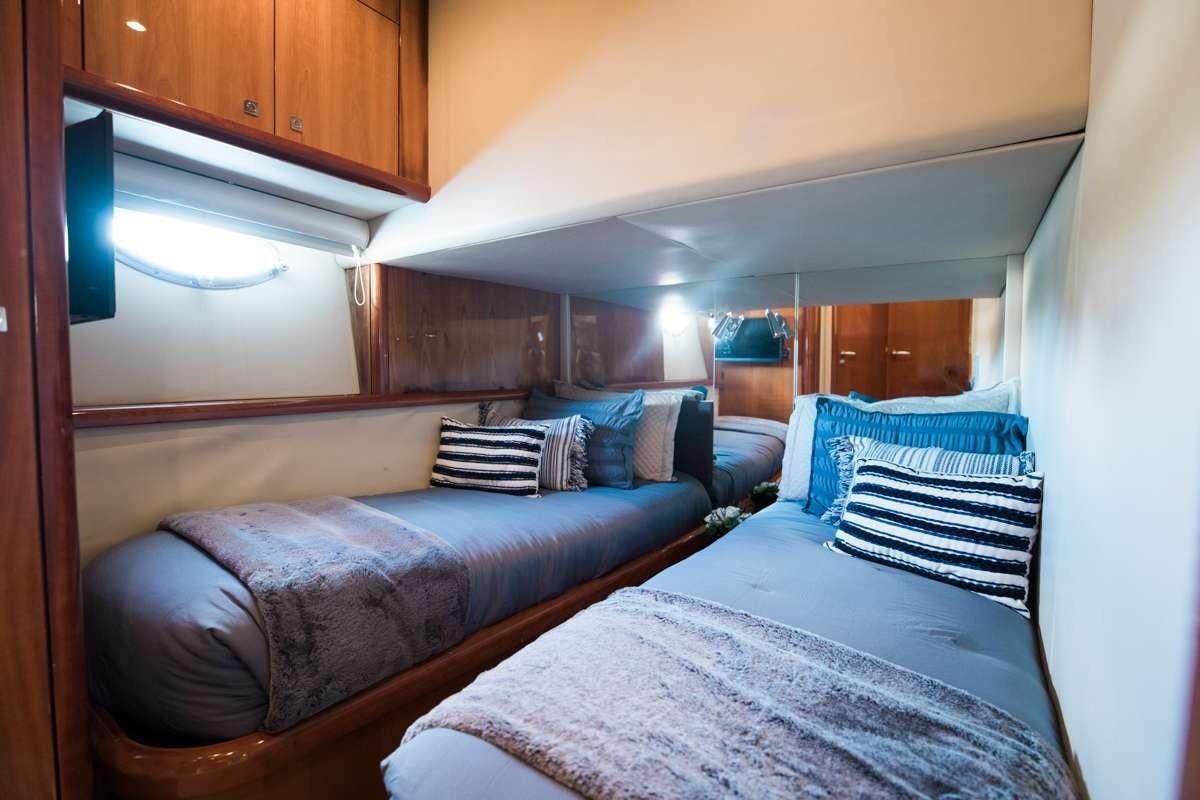 a couple of beds in a room aboard LION Yacht for Charter
