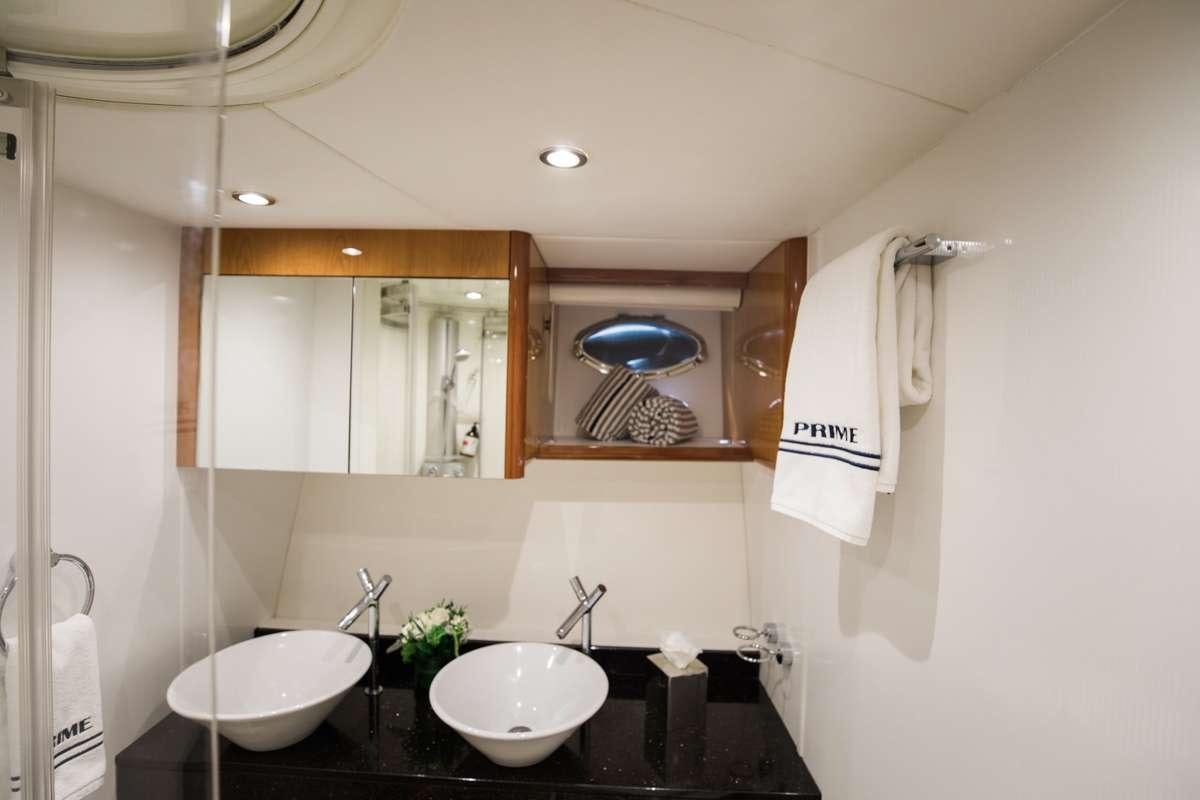a bathroom with a large mirror aboard LION Yacht for Charter