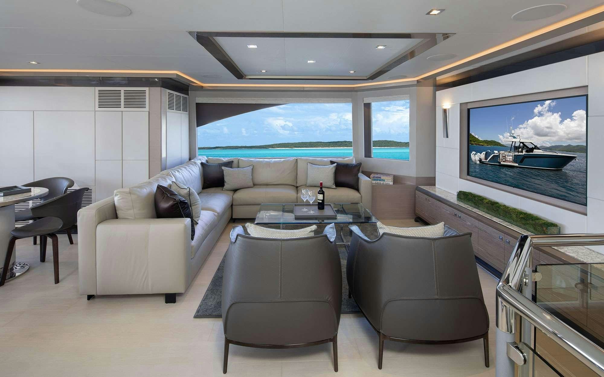 a living room with a large screen aboard DREAMS Yacht for Charter