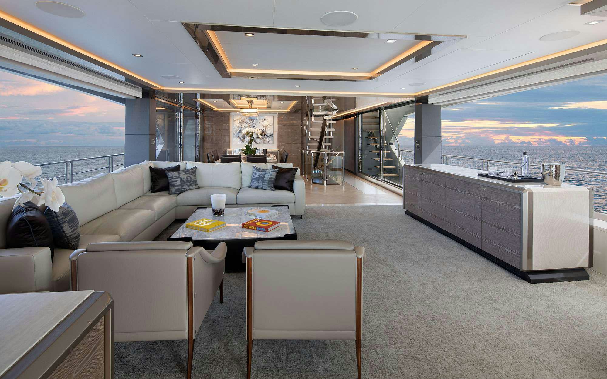 a living room with a large window aboard DREAMS Yacht for Charter