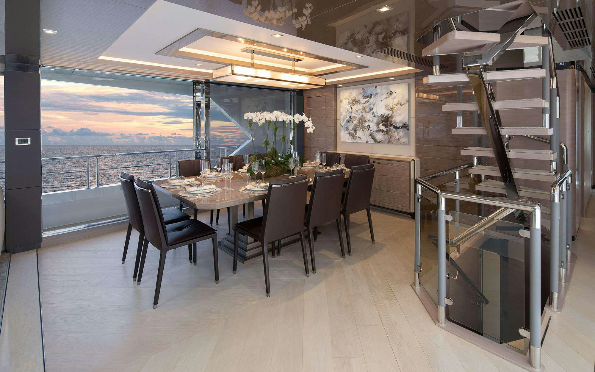 a room with a table and chairs aboard DREAMS Yacht for Charter