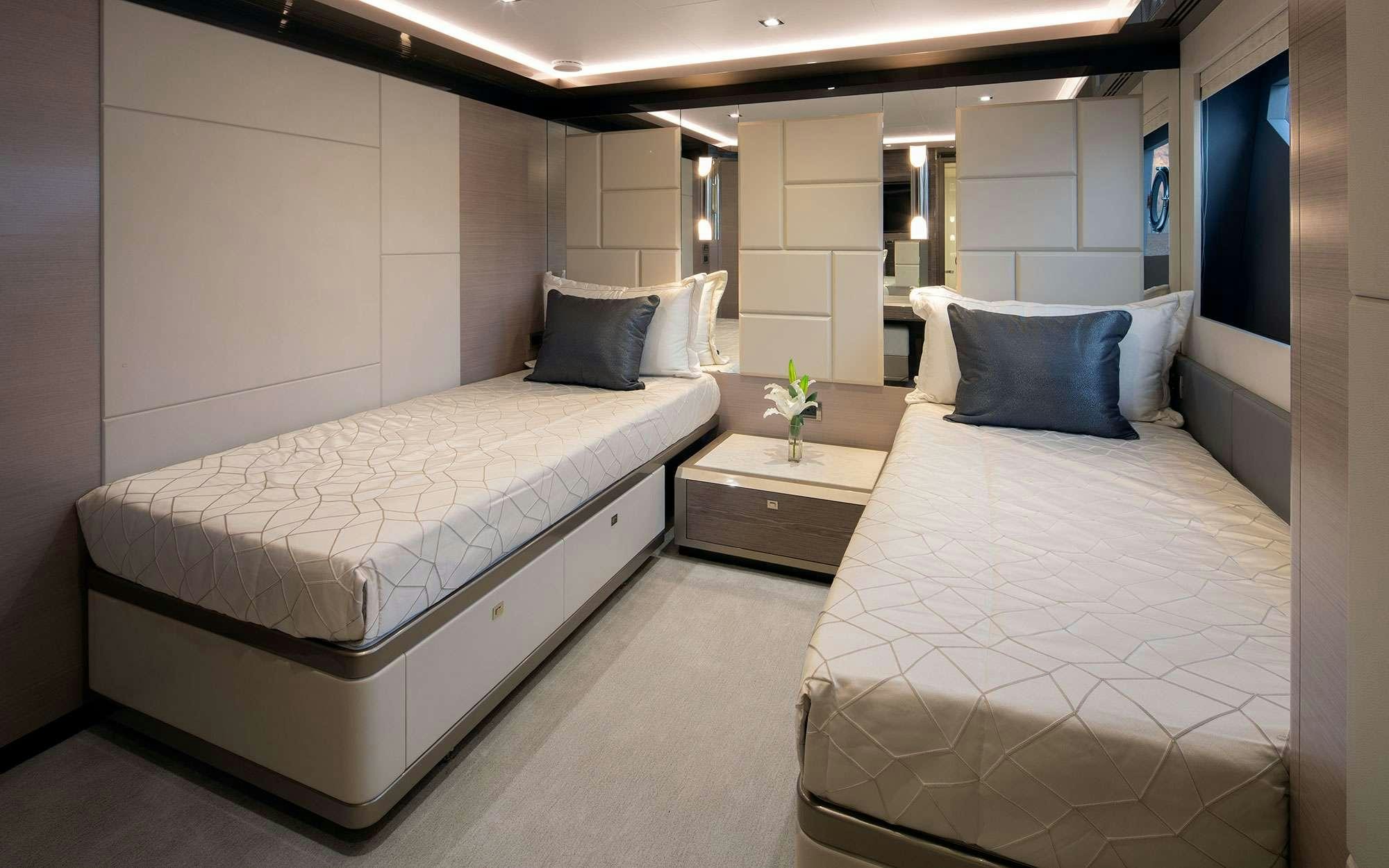 a room with two beds aboard DREAMS Yacht for Charter
