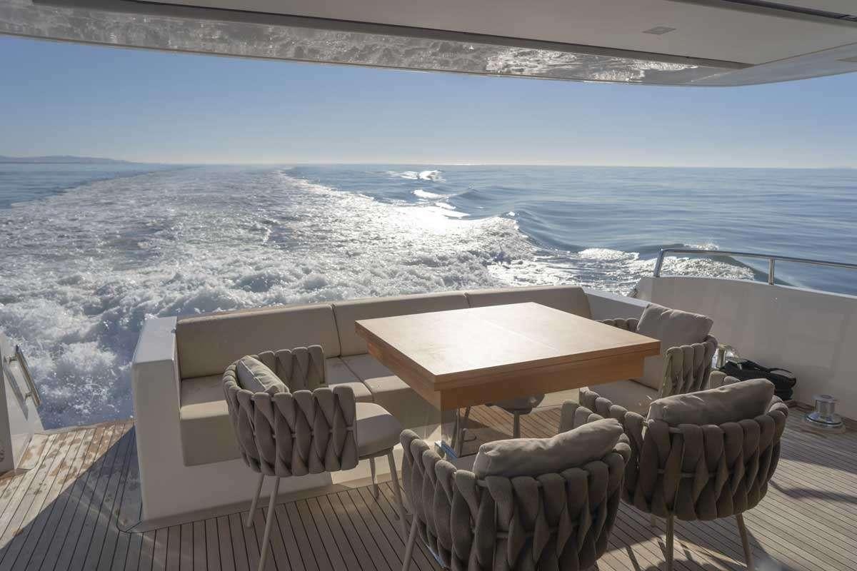 a room with a table and chairs aboard EM3 Yacht for Charter