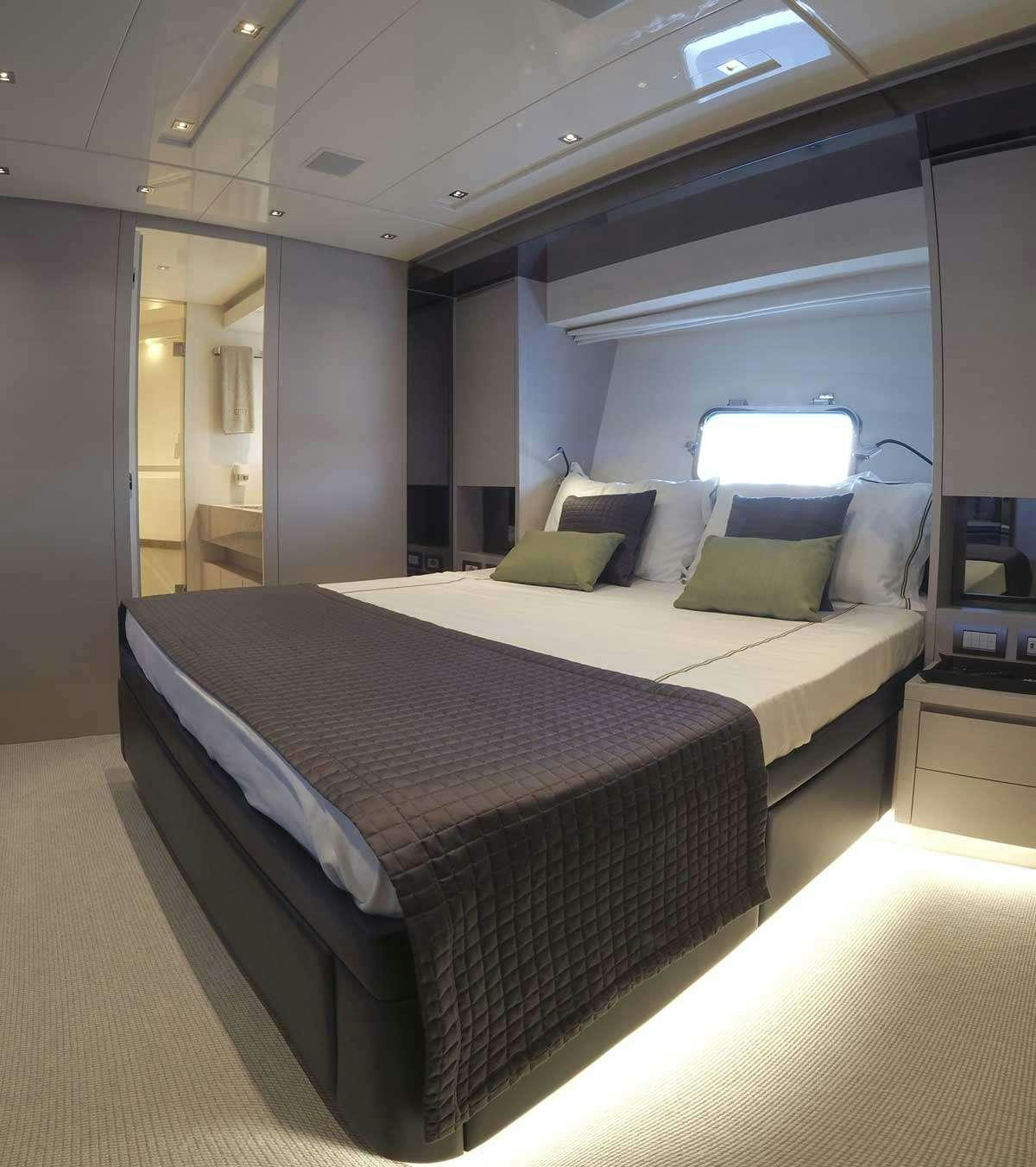 a bed in a room aboard EM3 Yacht for Charter