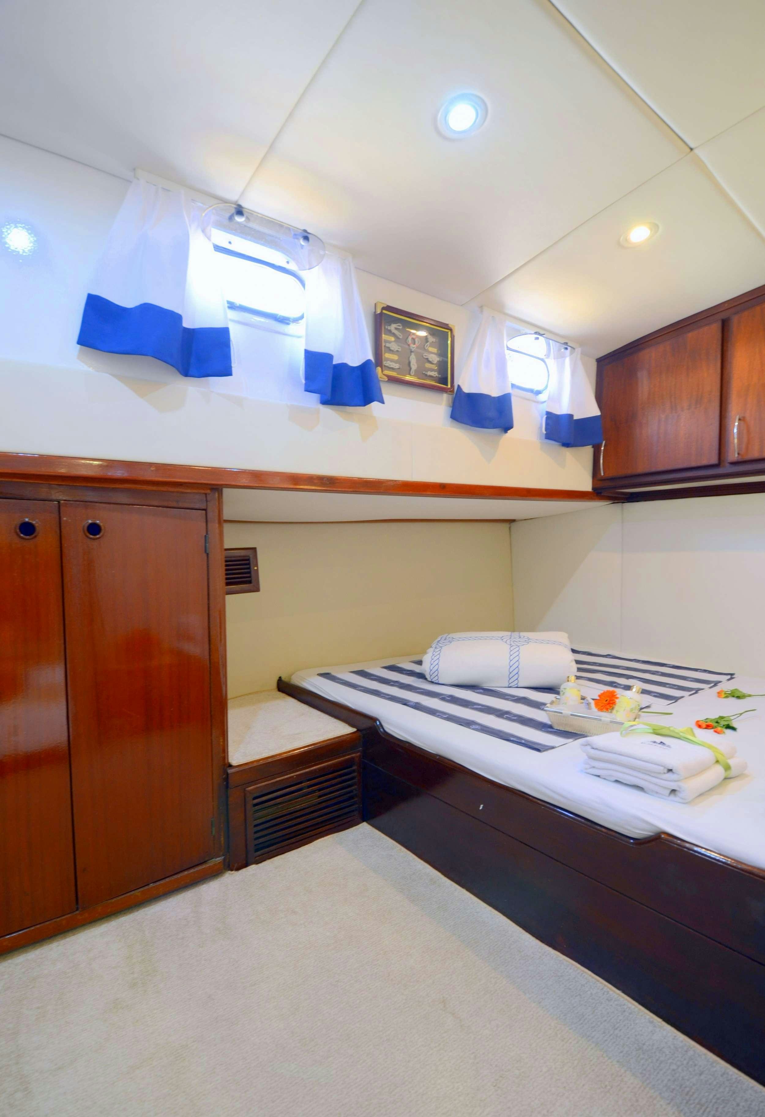 a bed in a room aboard FORTUNA Yacht for Charter