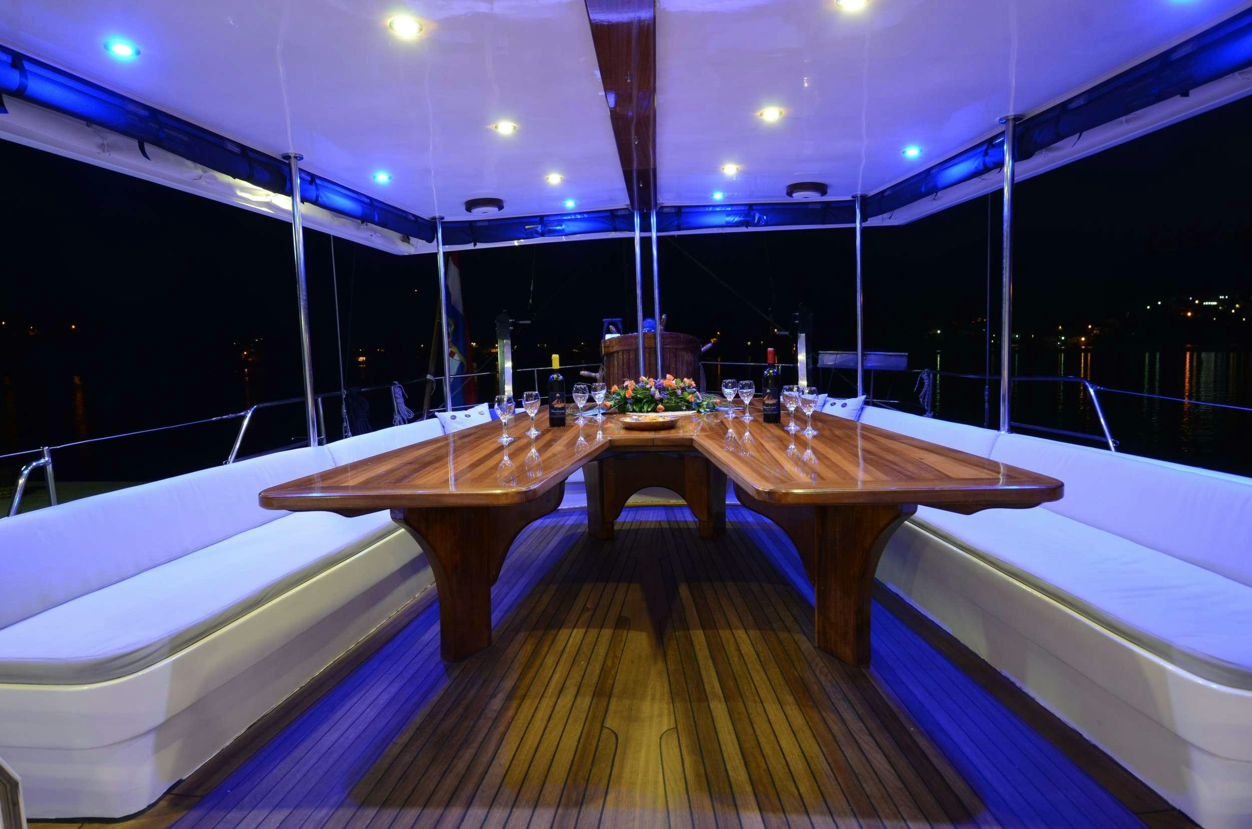 a wooden dock with a large pool aboard FORTUNA Yacht for Charter