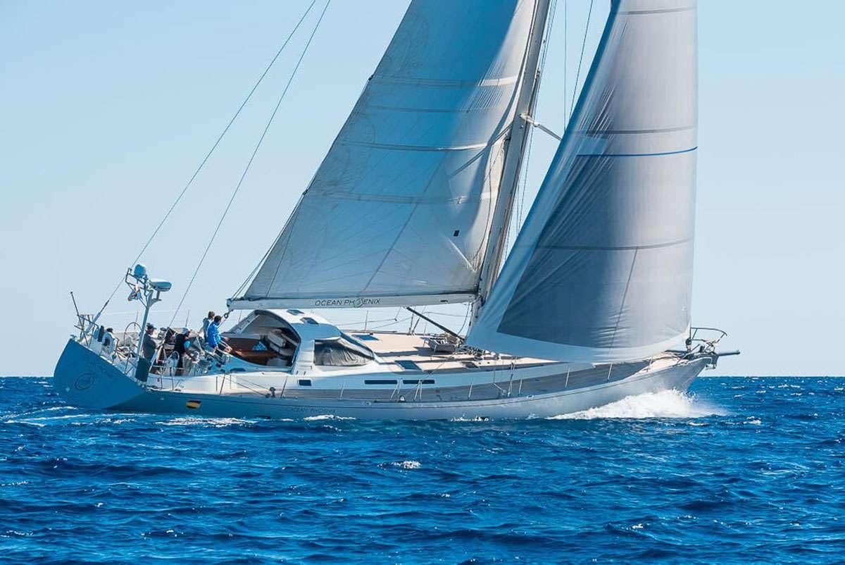 a sailboat on the water aboard OCEAN PHOENIX Yacht for Charter