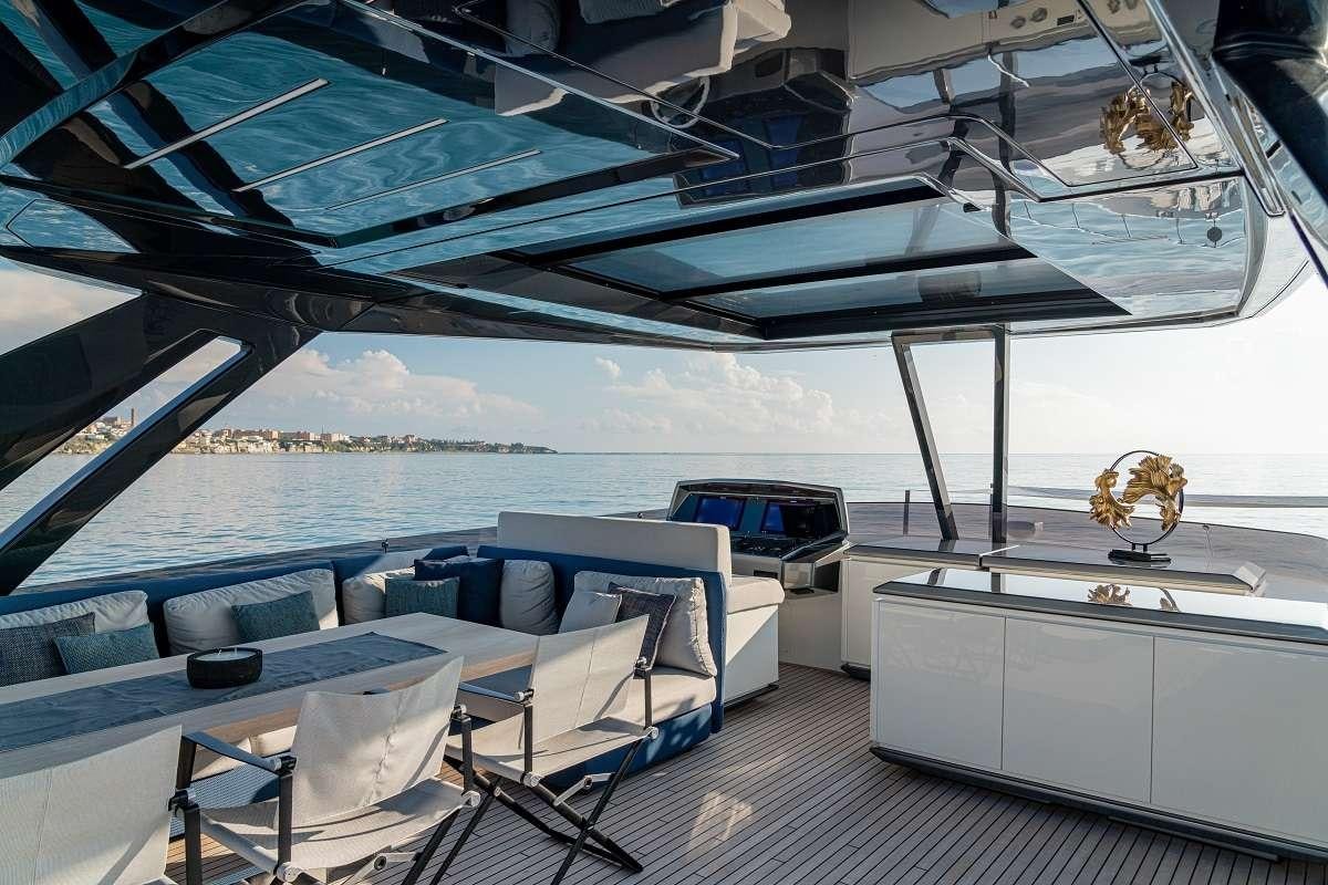 a boat with a deck and chairs aboard YEMAJA Yacht for Charter