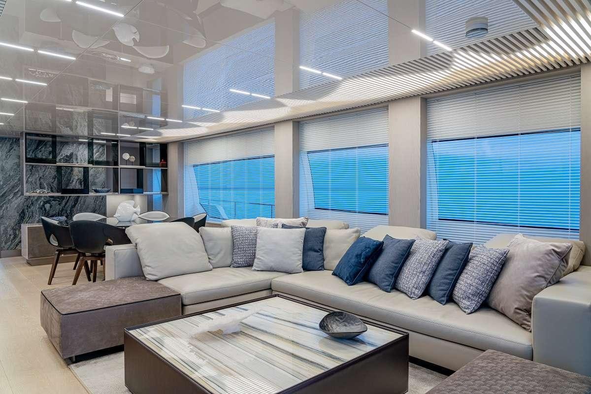 a living room with a couch and a table aboard YEMAJA Yacht for Charter