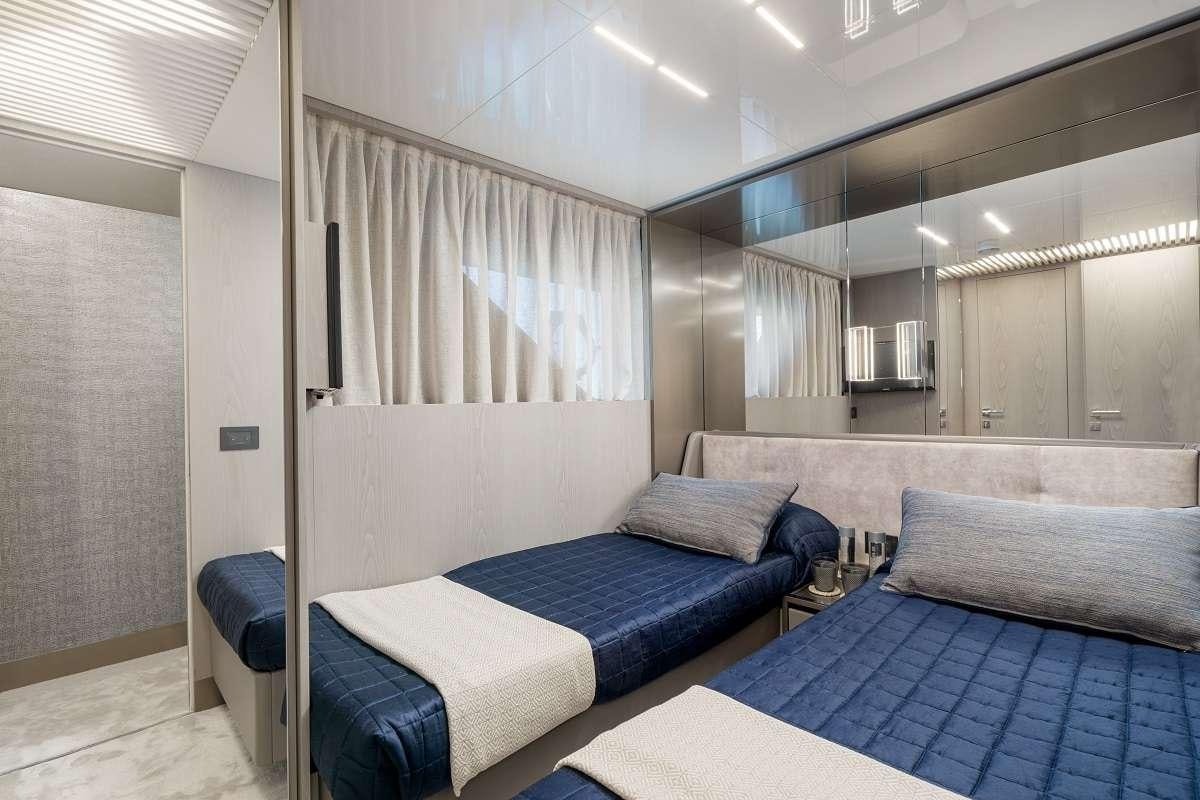 a room with a bed and a couch aboard YEMAJA Yacht for Charter