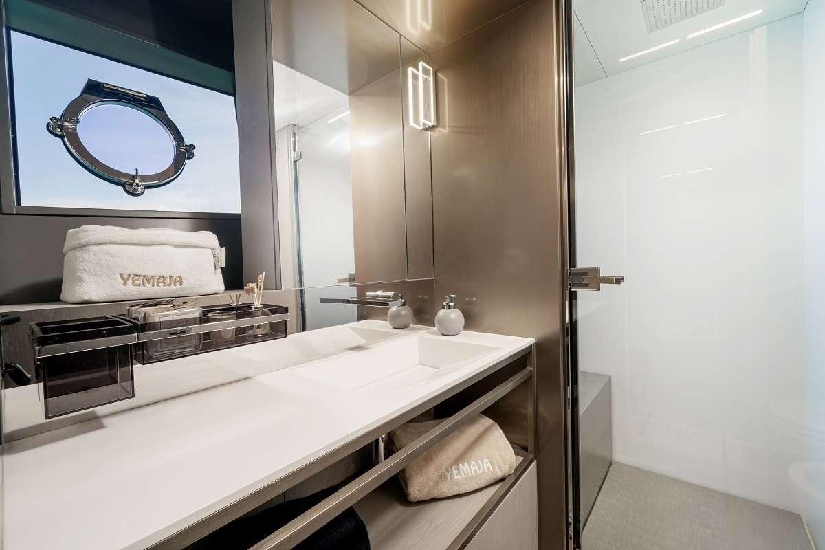 a bathroom with a large mirror aboard YEMAJA Yacht for Charter