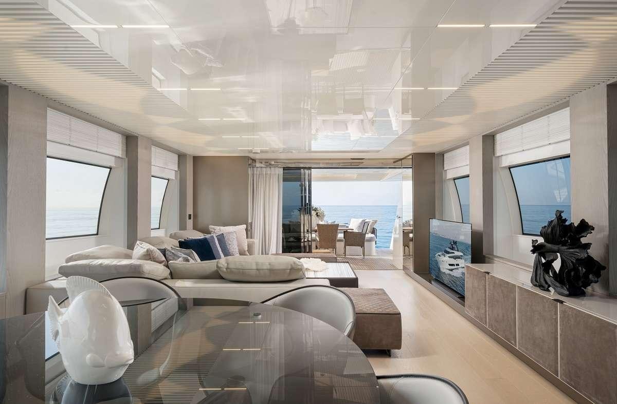 a living room with a large window aboard YEMAJA Yacht for Charter
