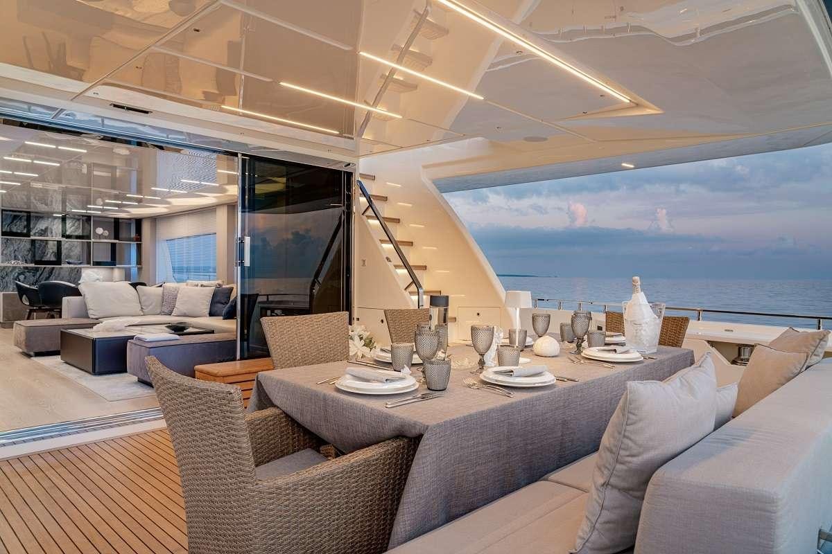 a living room with a large window aboard YEMAJA Yacht for Charter