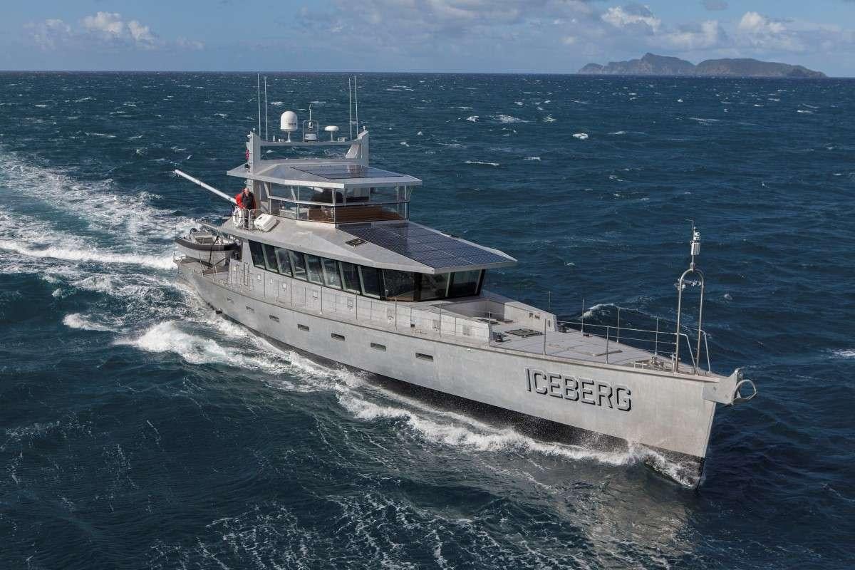 a large white boat in the water aboard ICEBERG Yacht for Charter