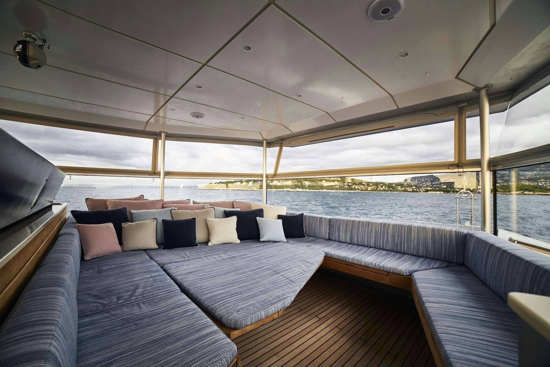 a large bed with a large window aboard ICEBERG Yacht for Charter