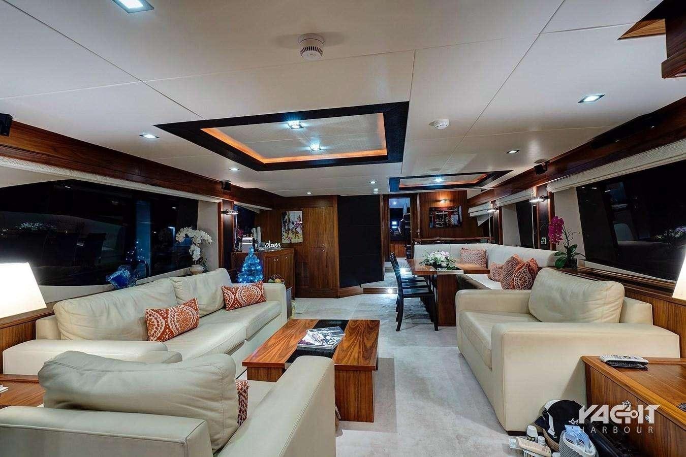 a living room with a couch and a table aboard SPLASHED OUT Yacht for Charter