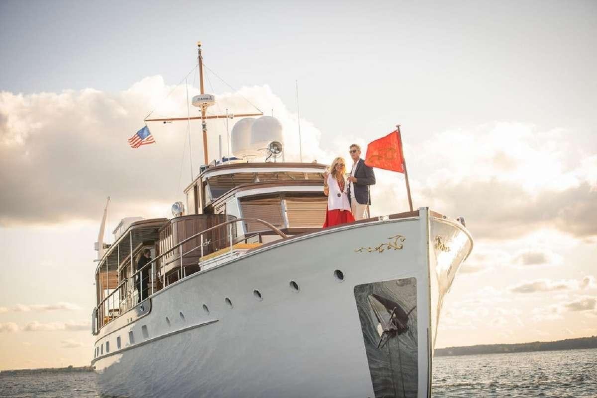 a couple standing on a boat aboard TIMELESS Yacht for Charter