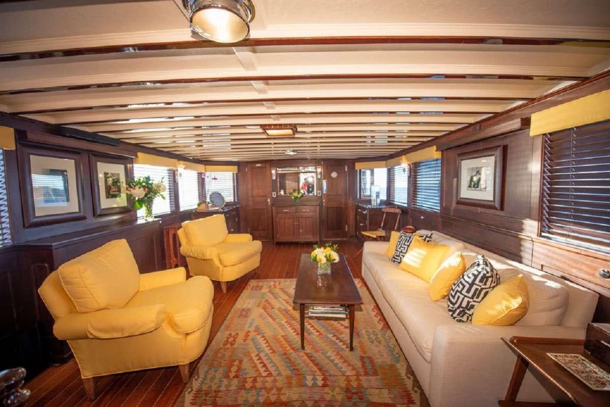 a living room with a large window aboard TIMELESS Yacht for Charter