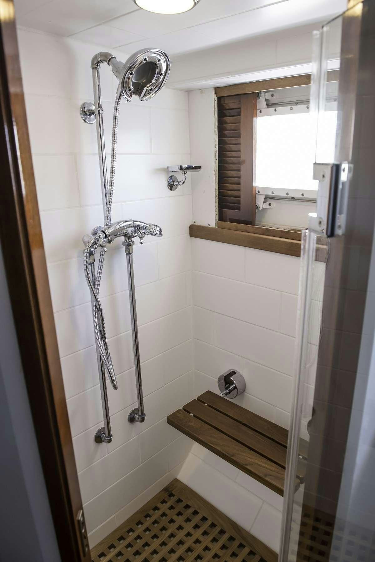 a shower unit in a bathroom aboard TIMELESS Yacht for Charter