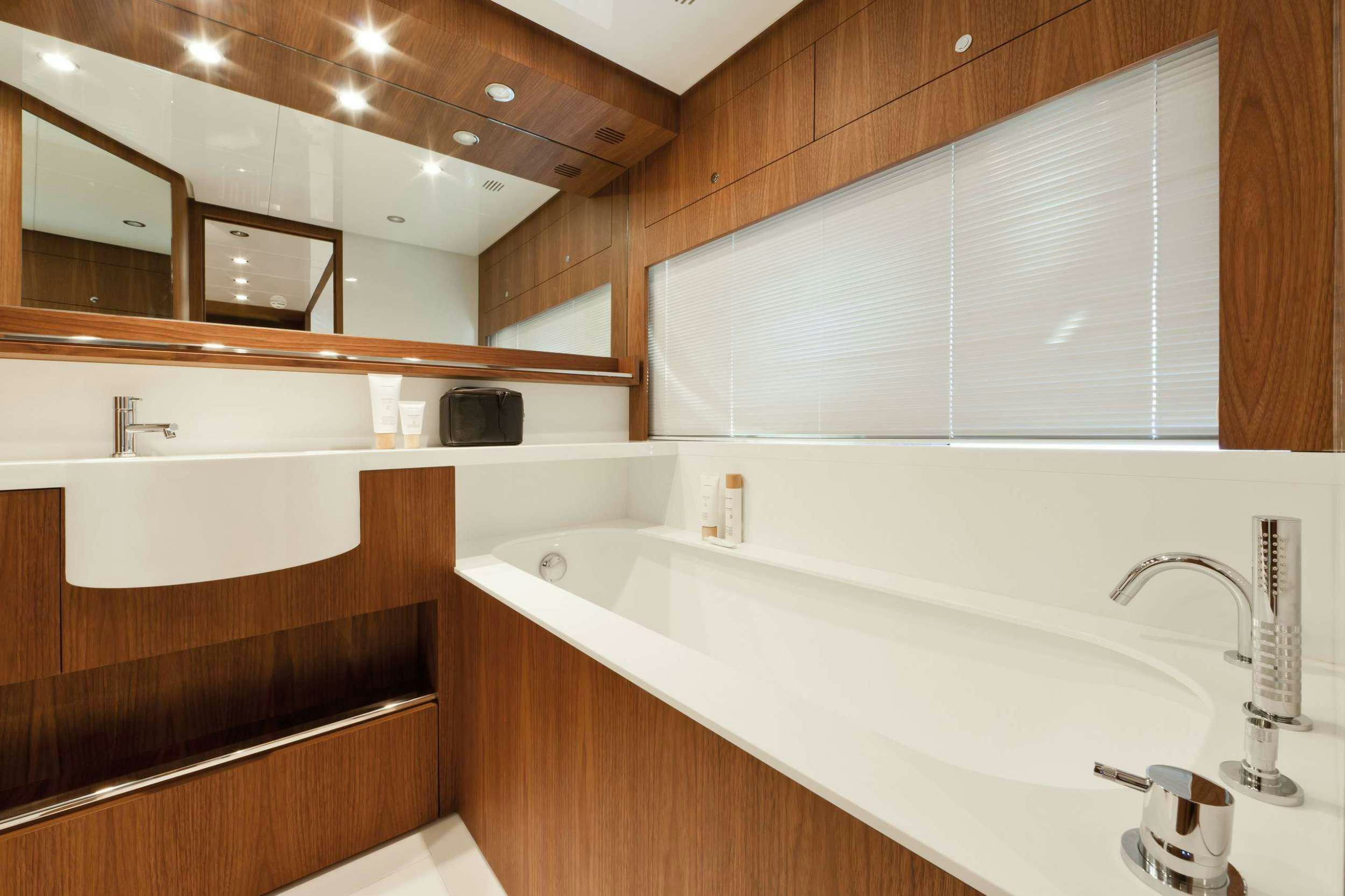 a bathroom with a large jacuzzi tub aboard PRIVILEGIO Yacht for Charter
