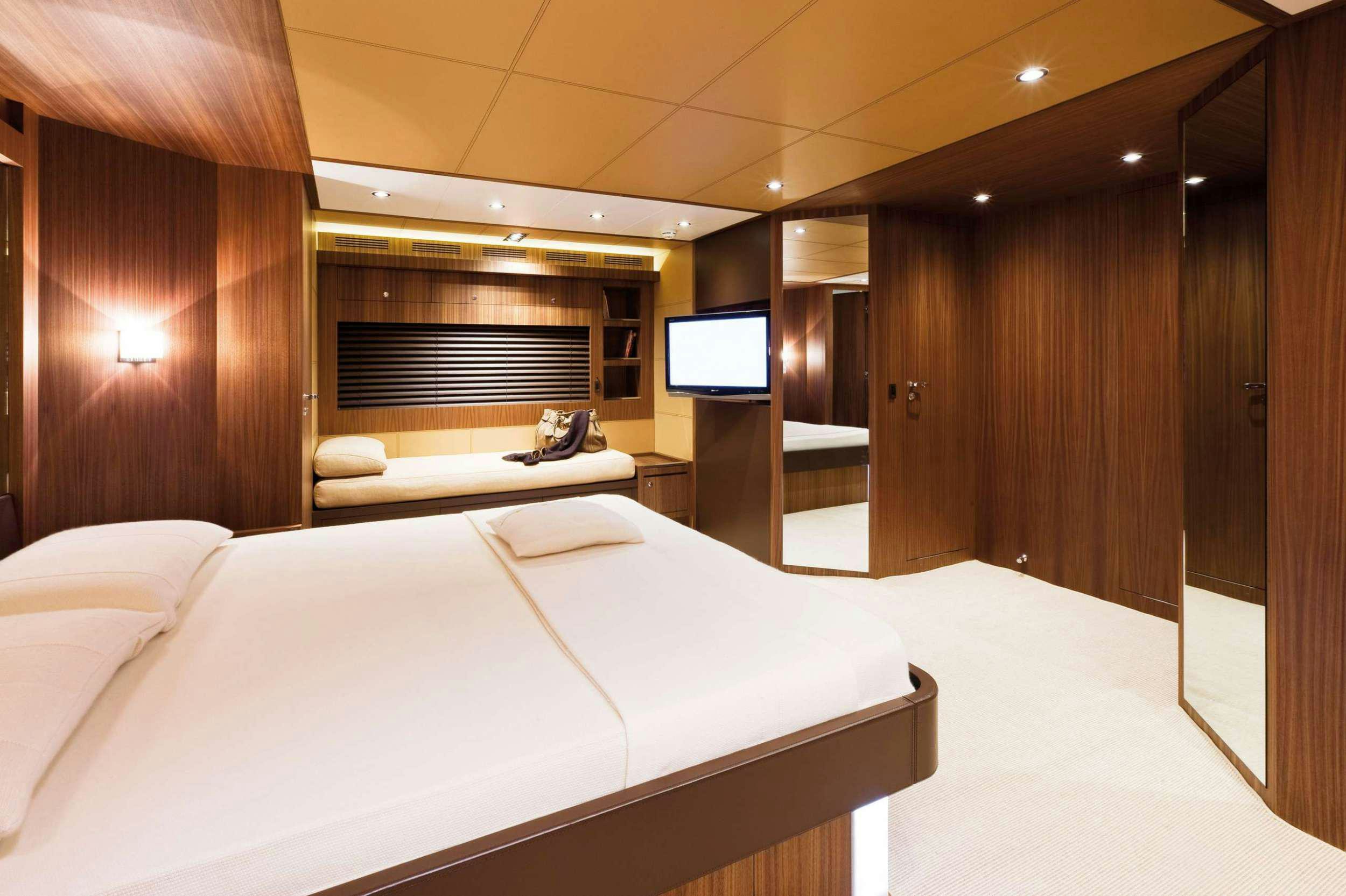 a hotel room with a bed aboard PRIVILEGIO Yacht for Charter
