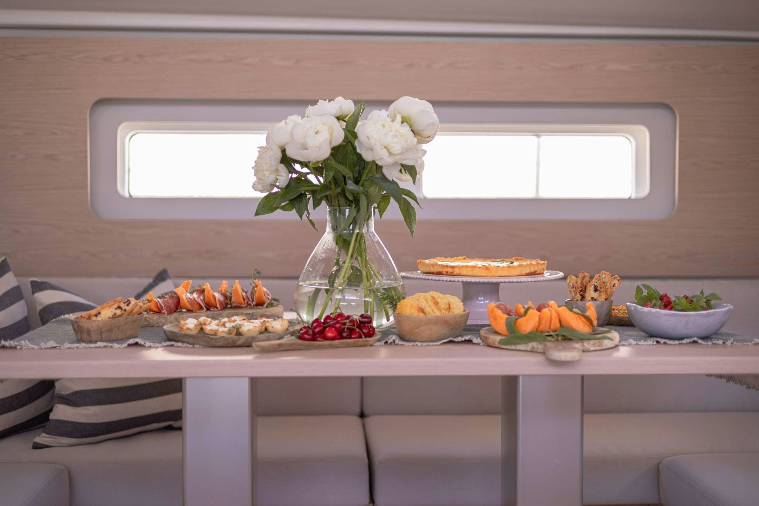 a table with food on it aboard WHITE BIRD Yacht for Charter