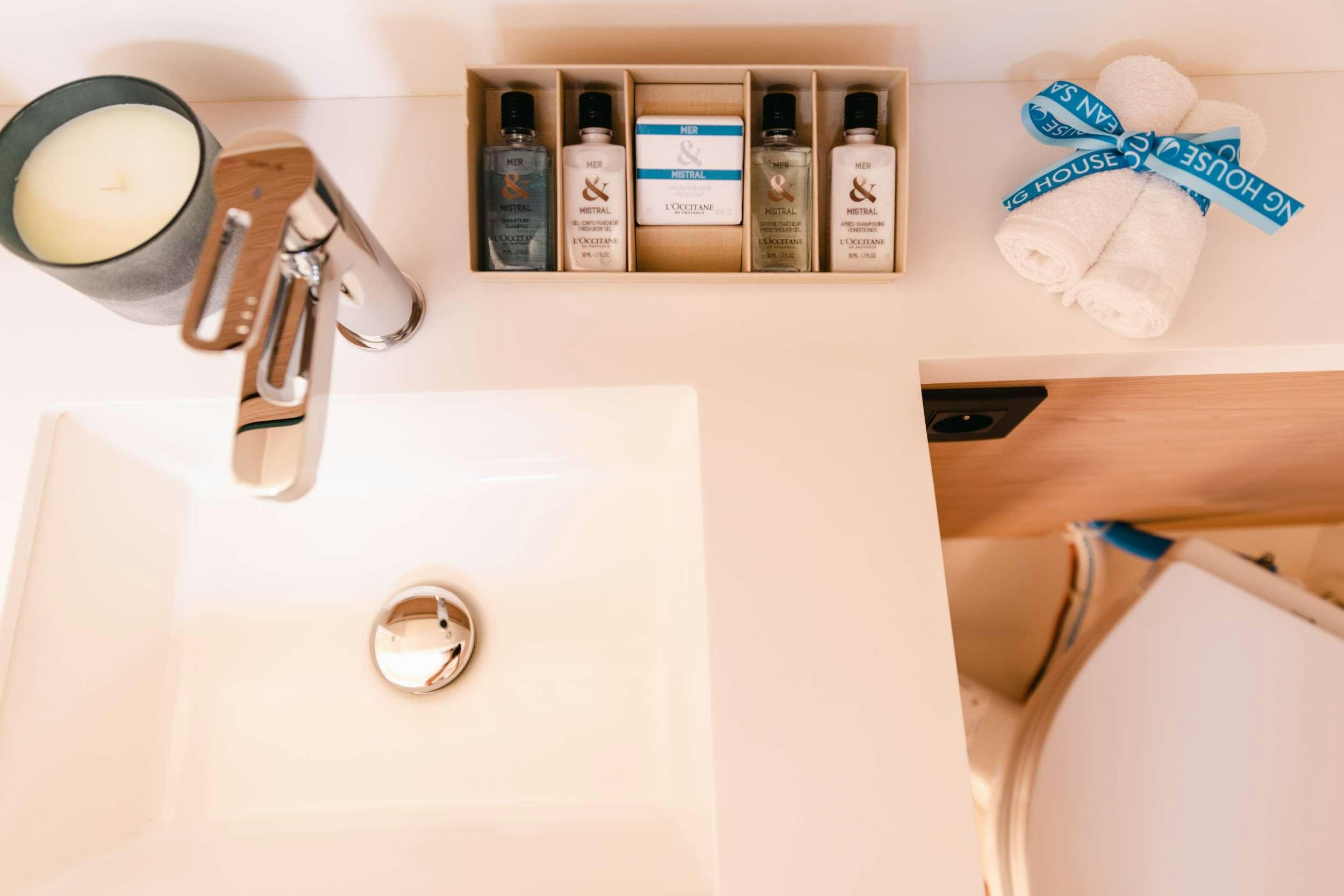 a sink with a variety of products aboard WHITE BIRD Yacht for Charter