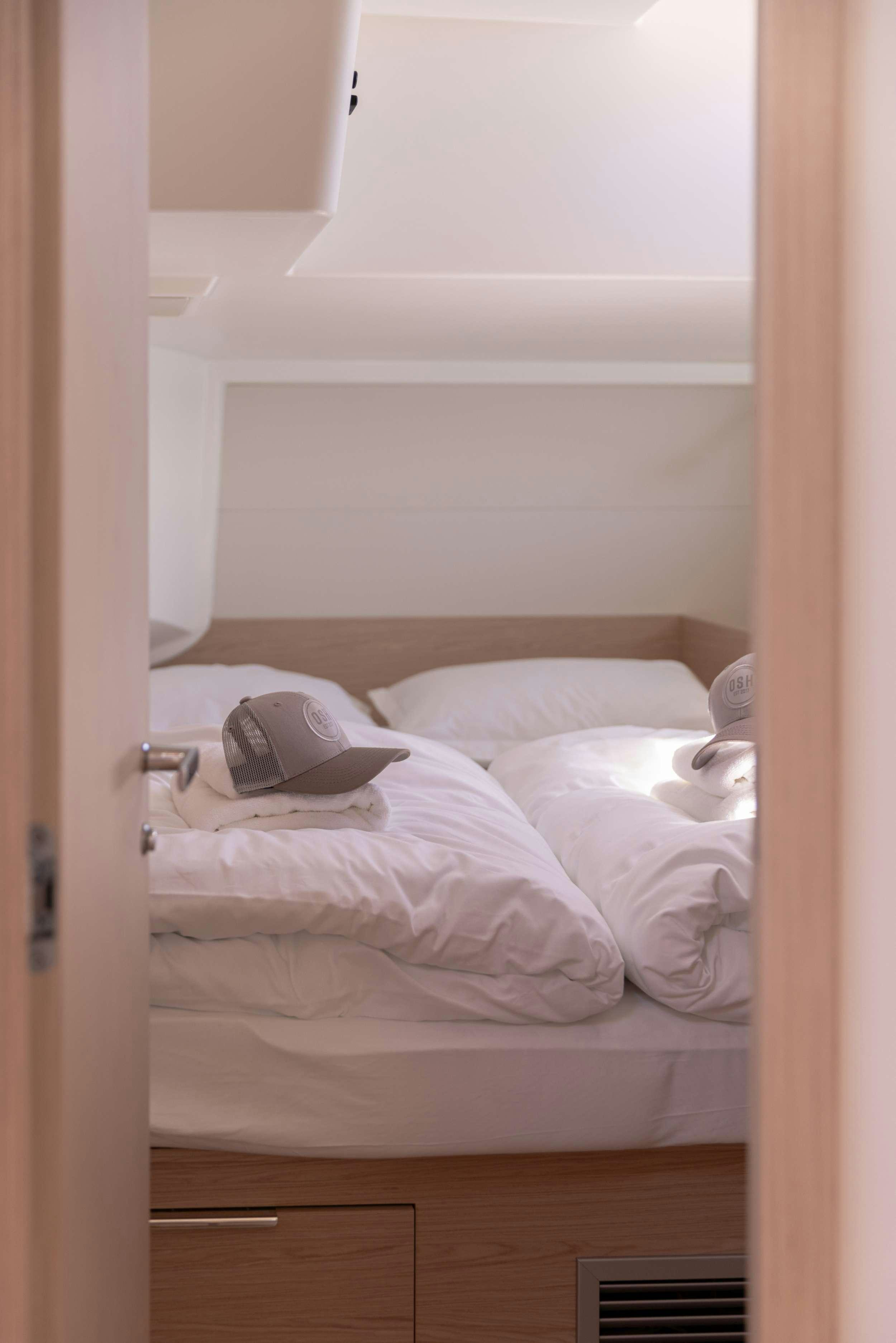 a couple of white pillows on a shelf aboard WHITE BIRD Yacht for Charter