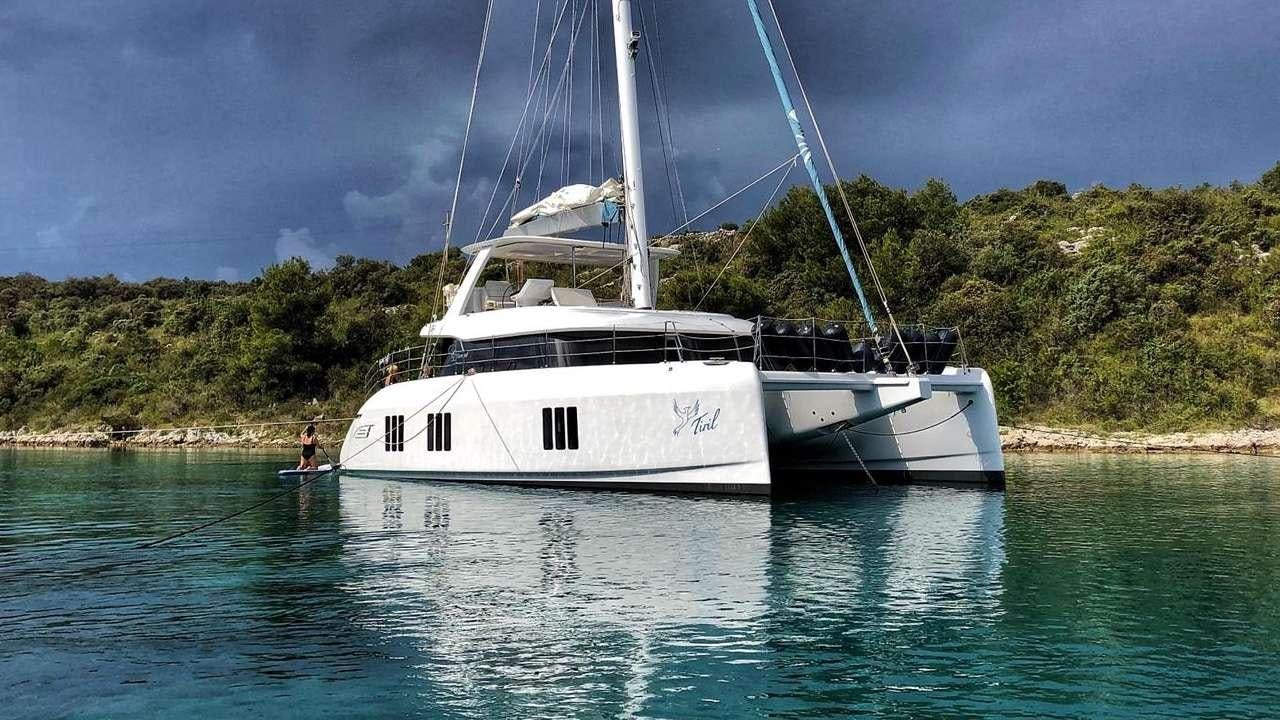 a couple of boats in the water aboard TIRIL Yacht for Charter