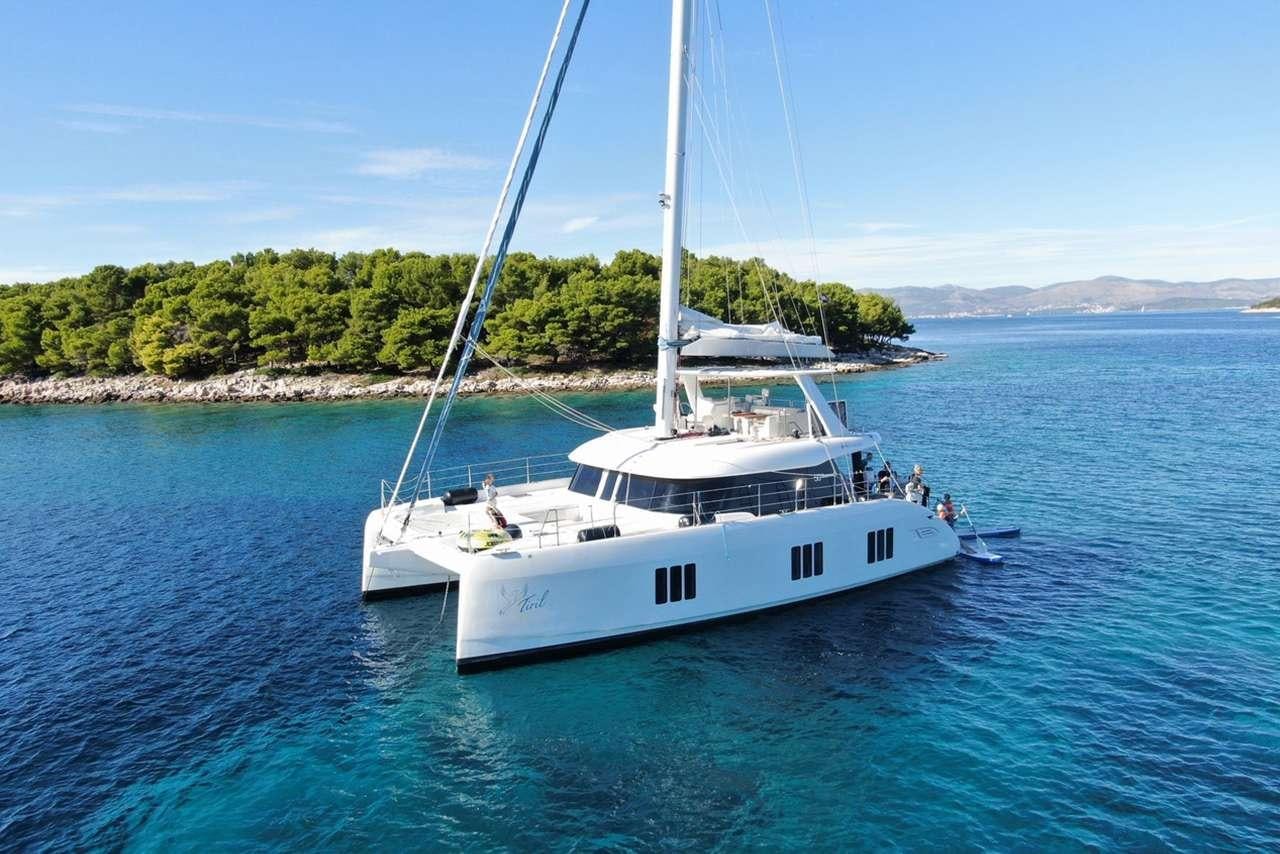 a white boat in the water aboard TIRIL Yacht for Charter