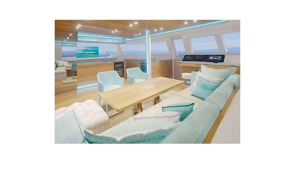 a room with a couch and a table aboard TIRIL Yacht for Charter