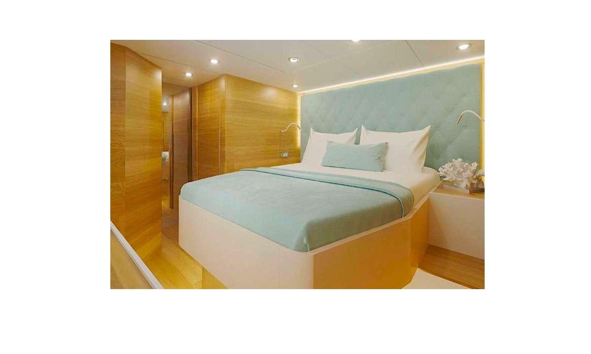 a bed in a room aboard TIRIL Yacht for Charter