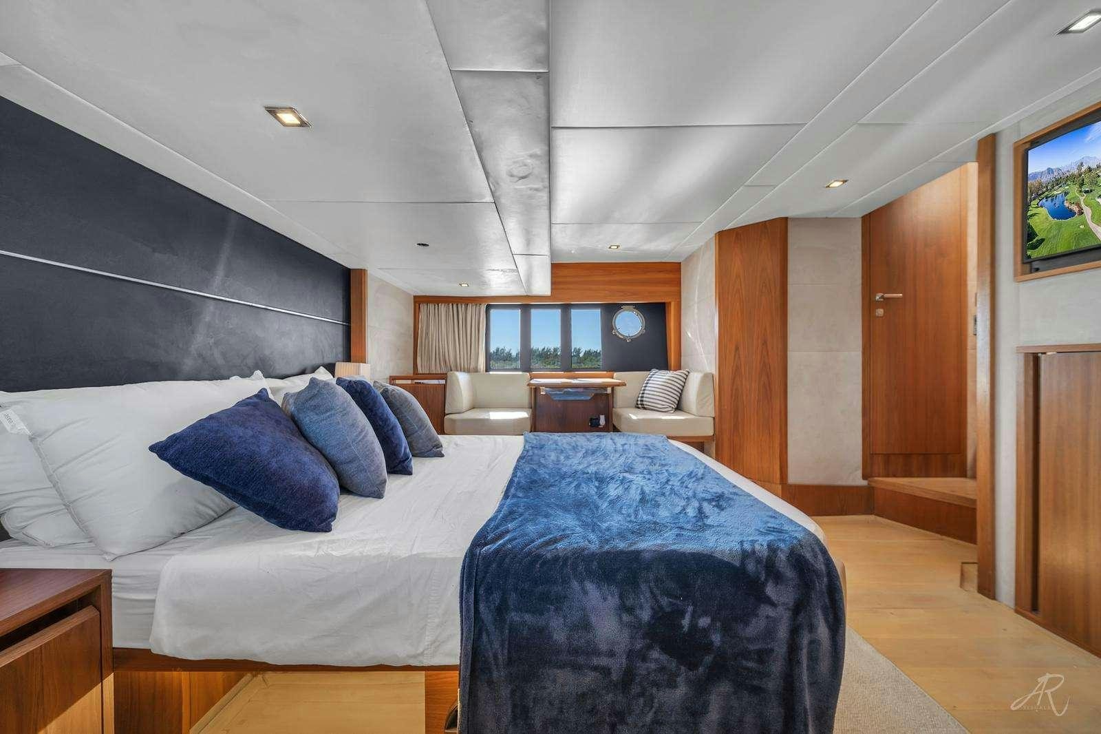 a large bedroom with a bed aboard TWO Yacht for Charter