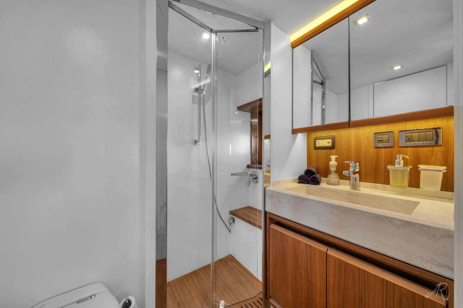 a shower unit in a bathroom aboard TWO Yacht for Charter