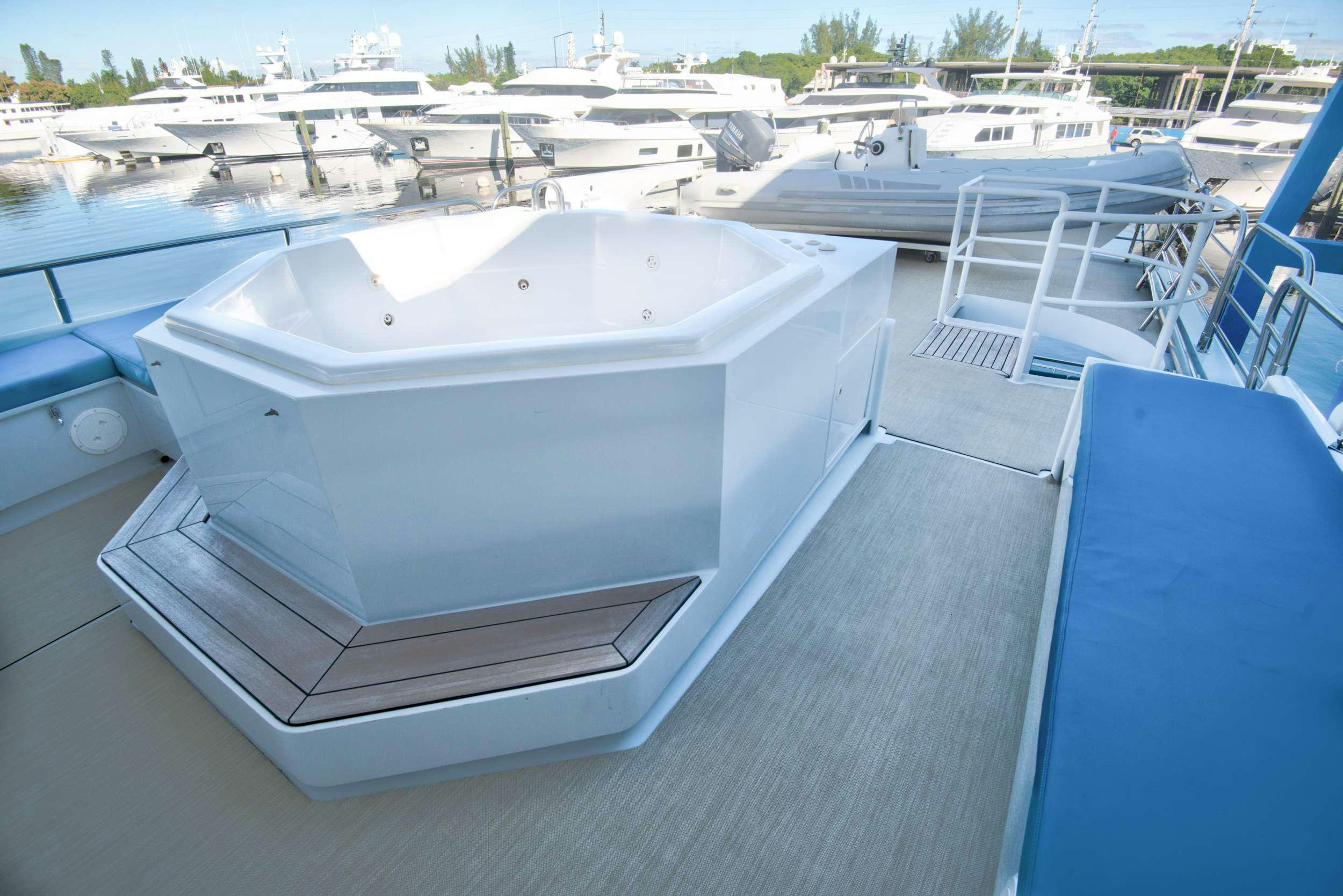 a white boat on a dock aboard DESLIZE Yacht for Charter