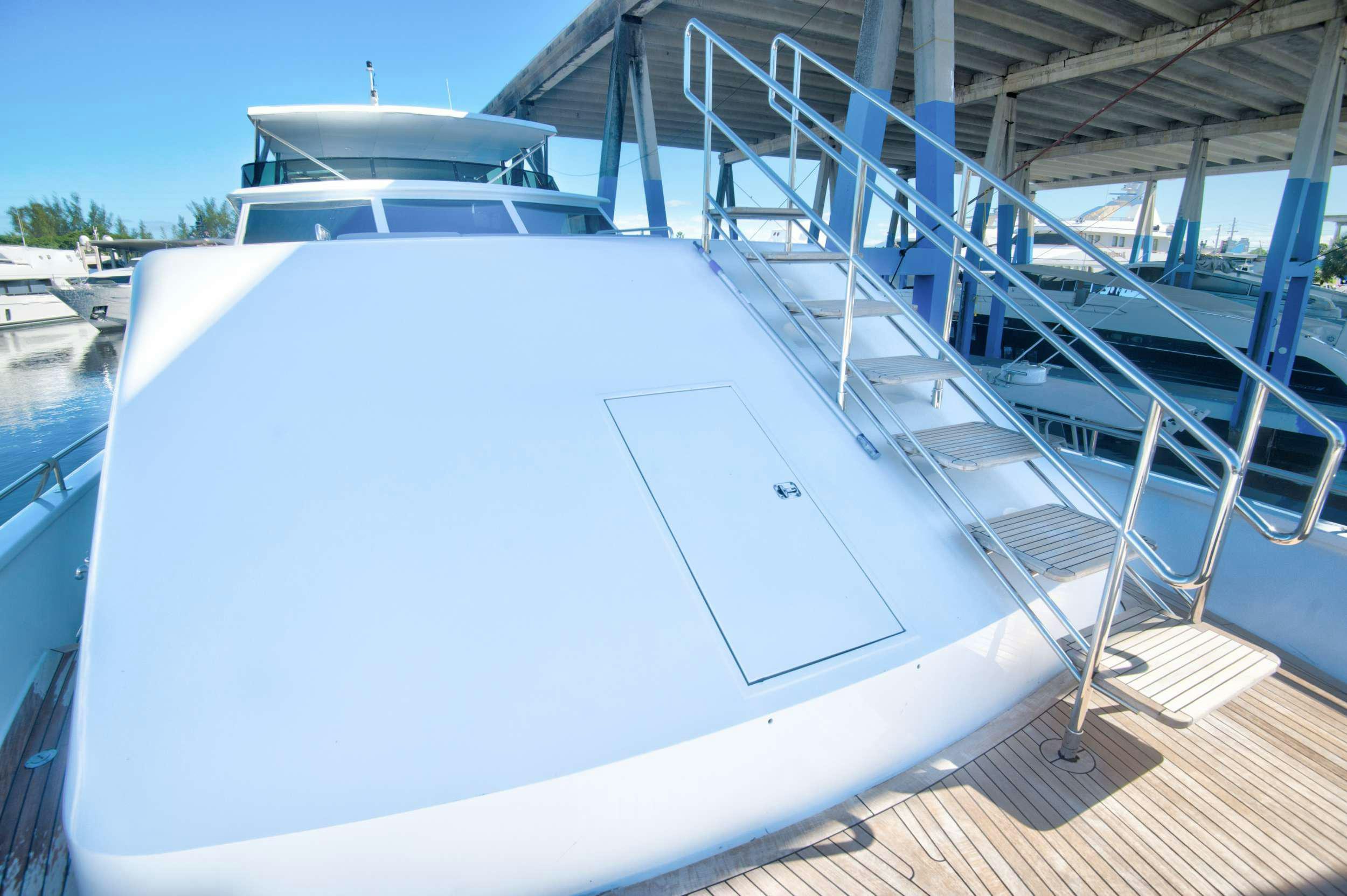 a white boat on a deck aboard DESLIZE Yacht for Charter